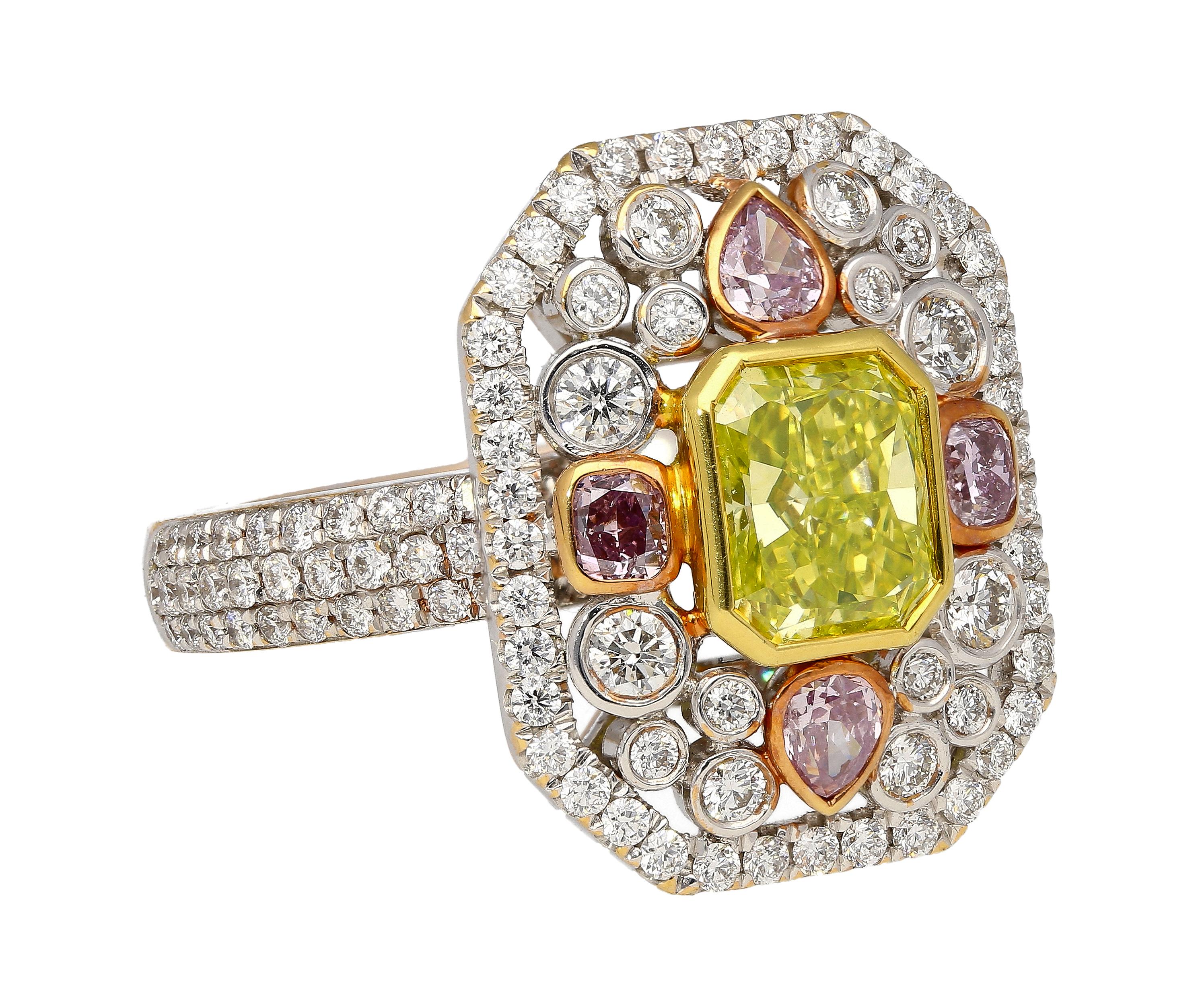 18k tri-colored gold long frame rectangular shaped ring with multi-colored natural diamonds. Featuring a GIA certified 1.15 carat Fancy Intense Yellowish Green radiant cut with even distribution and VS1 clarity. The long vertical frame sits