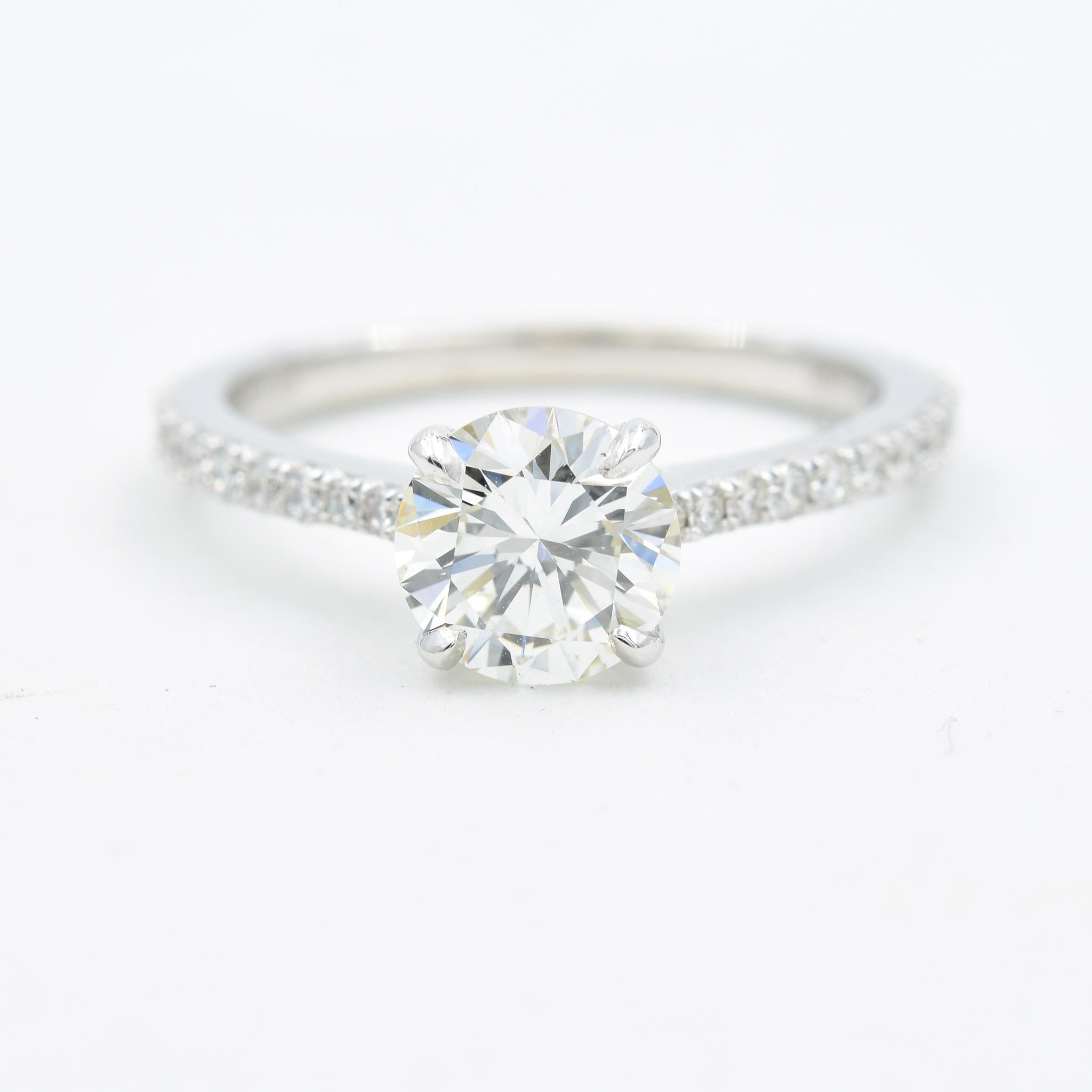 This engagement ring has 1.54 carats total weight of diamonds with 1.15 carats in the center diamond.  The center is a round brilliant cut and graded by GIA.  
