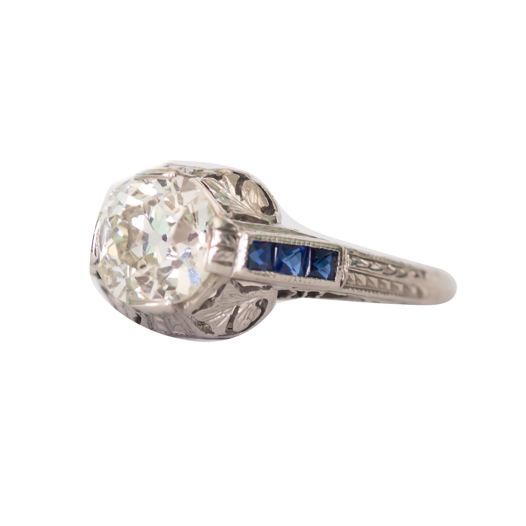 Ring Size: 5.75
Metal Type: Platinum  [Hallmarked, and Tested]
Weight: 3 grams

Center Diamond Details:
GIA REPORT #6204430375
Weight: 1.17 carat
Cut:  Antique Cushion
Color: K 
Clarity: SI1

Side Sapphire Details:
Weight: .25 carat, total