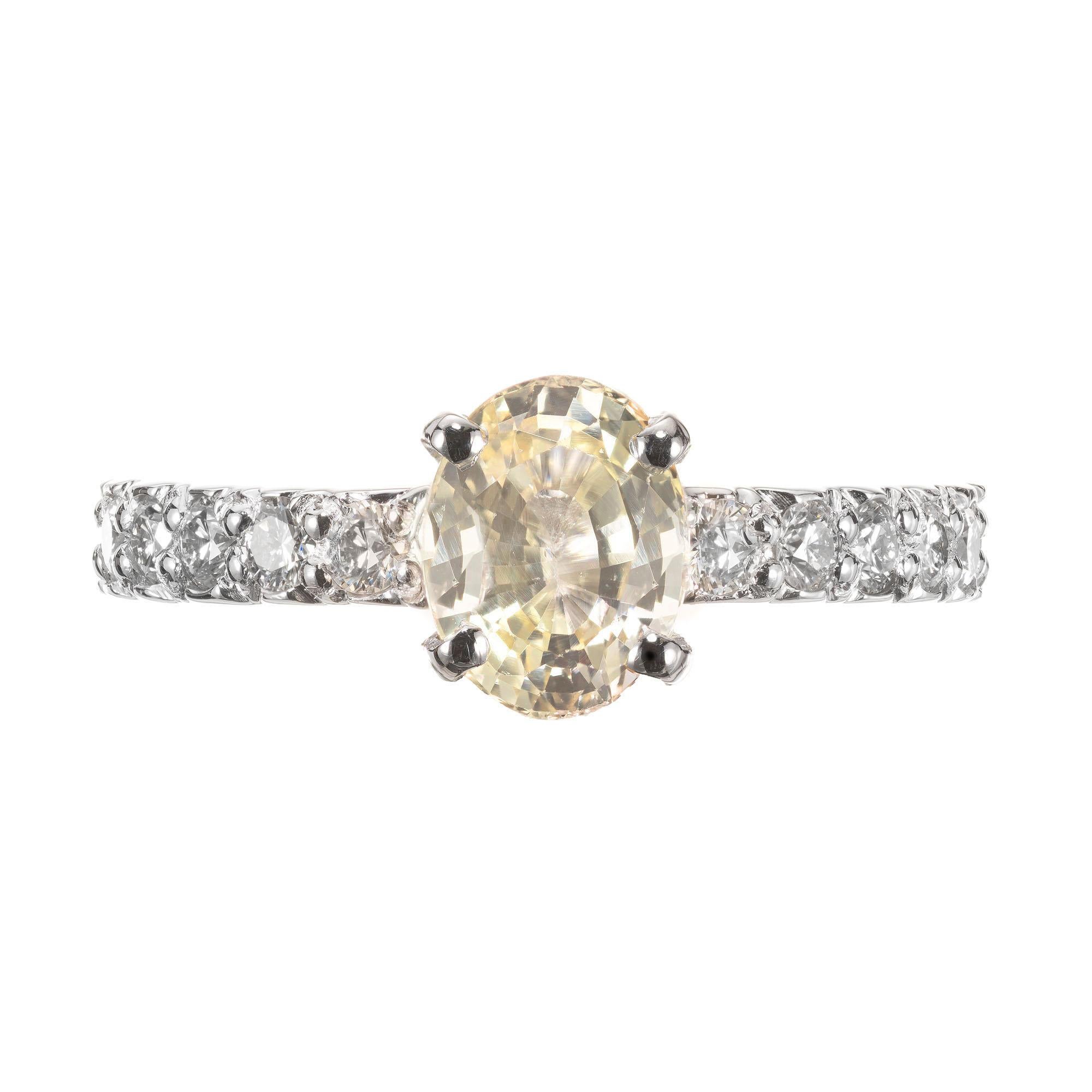 Natural no heat golden yellow sapphire and diamond engagement ring. GIA certified center stone in a platinum solitaire setting, with 14 bead set accent diamonds along the shank.

1 GIA certified oval natural no heat and no enhancements Sapphire
