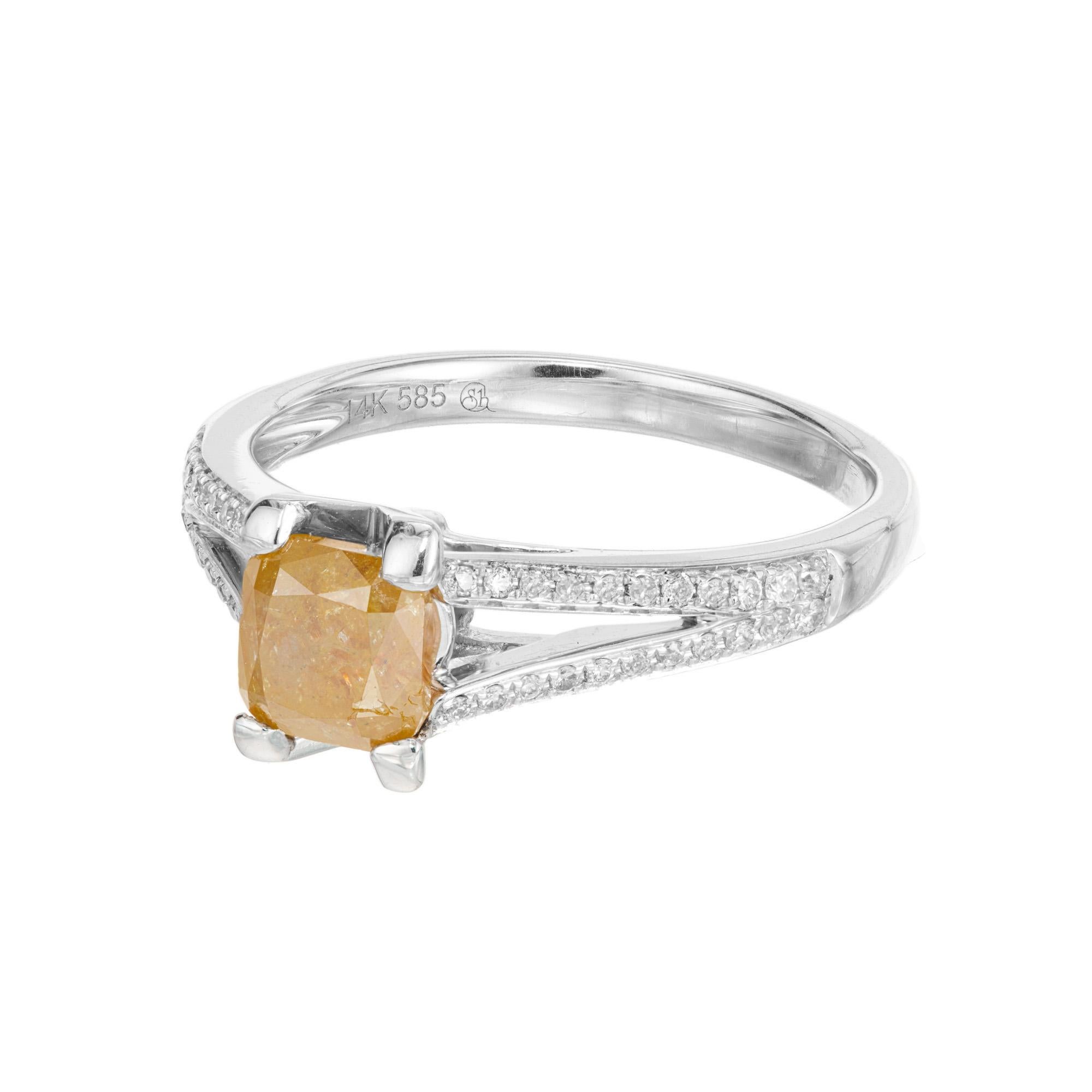 Yellow diamond engagement ring. This GIA certified natural color cushion square cut yellow center diamond, is set in a 14k white gold split shank setting, accented with a total of 44 round cut diamonds along each row of the shank. This is a very