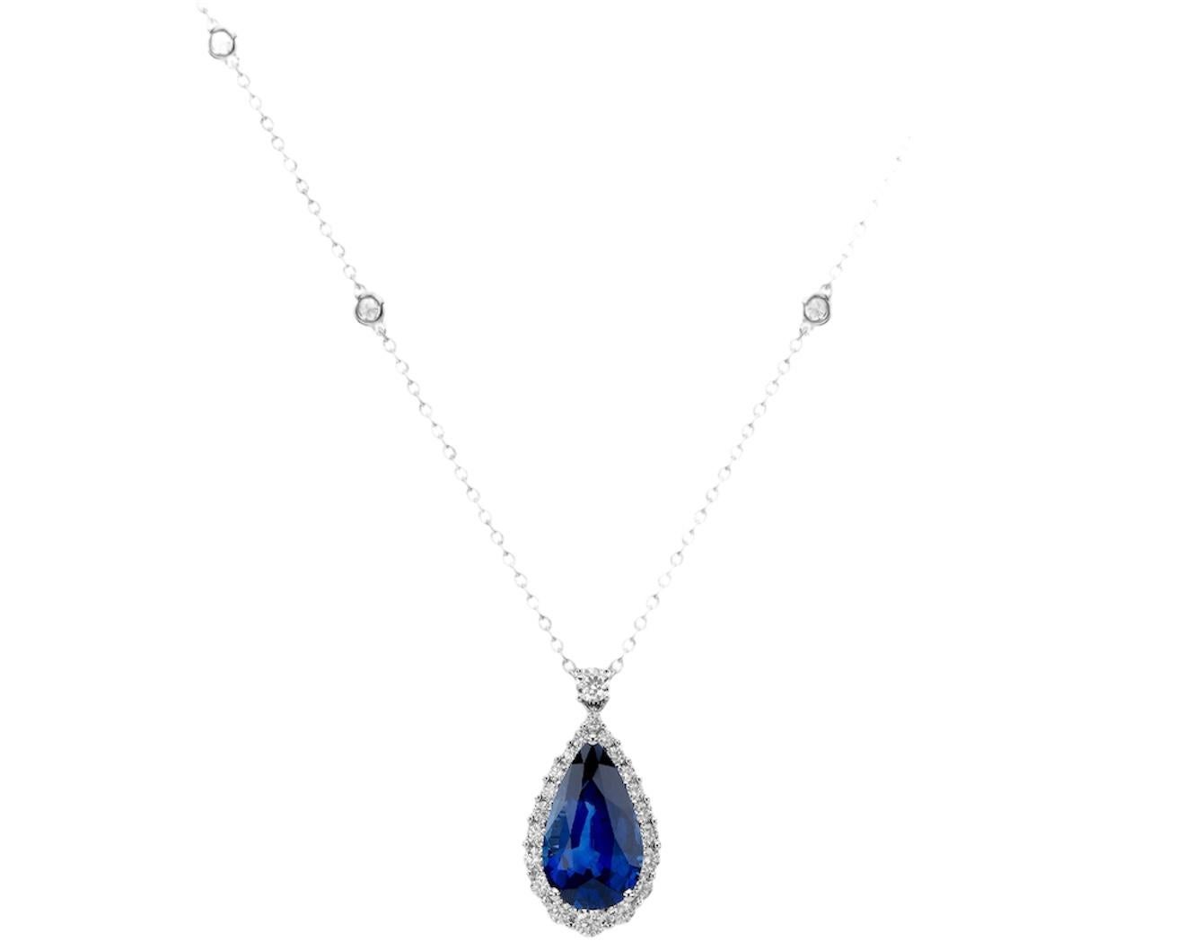 Centered upon a beautiful Pear shape Sapphire weighing 11.75 Carats that is accompanied by a GIA certificate. 
Surrounded by Round Diamonds weighing 1.05 Carats. 
Set in Platinum. 
Chain measures 18 inches. 