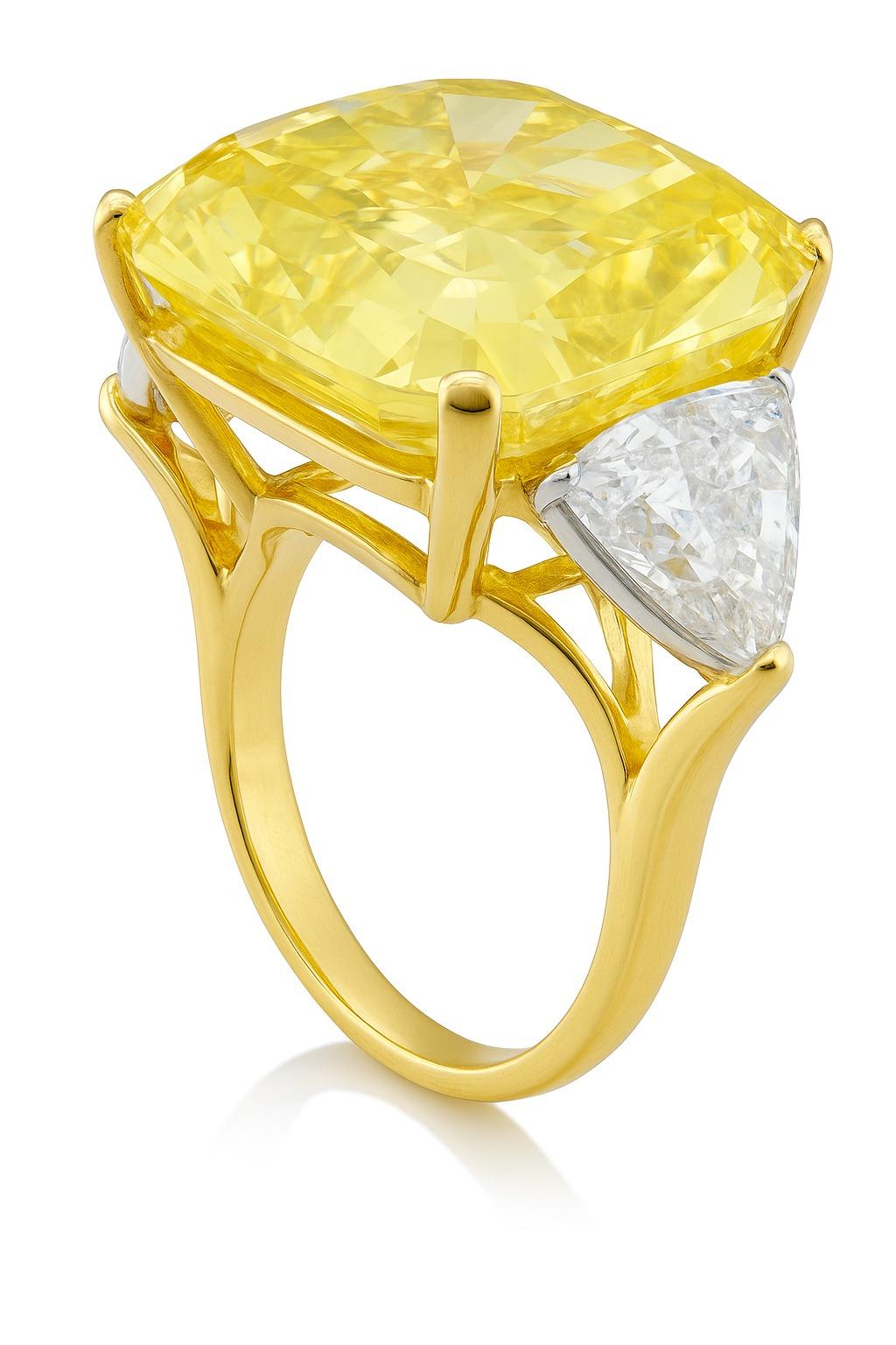 Bague en diamant jaune élégant de 11.83 carat certifié par le GIA

Cet extraordinaire diamant Fancy Yellow de 11,83 carats, certifié par le GIA, séduit par sa couleur riche et naturelle et sa remarquable clarté. La forme rectangulaire modifiée du