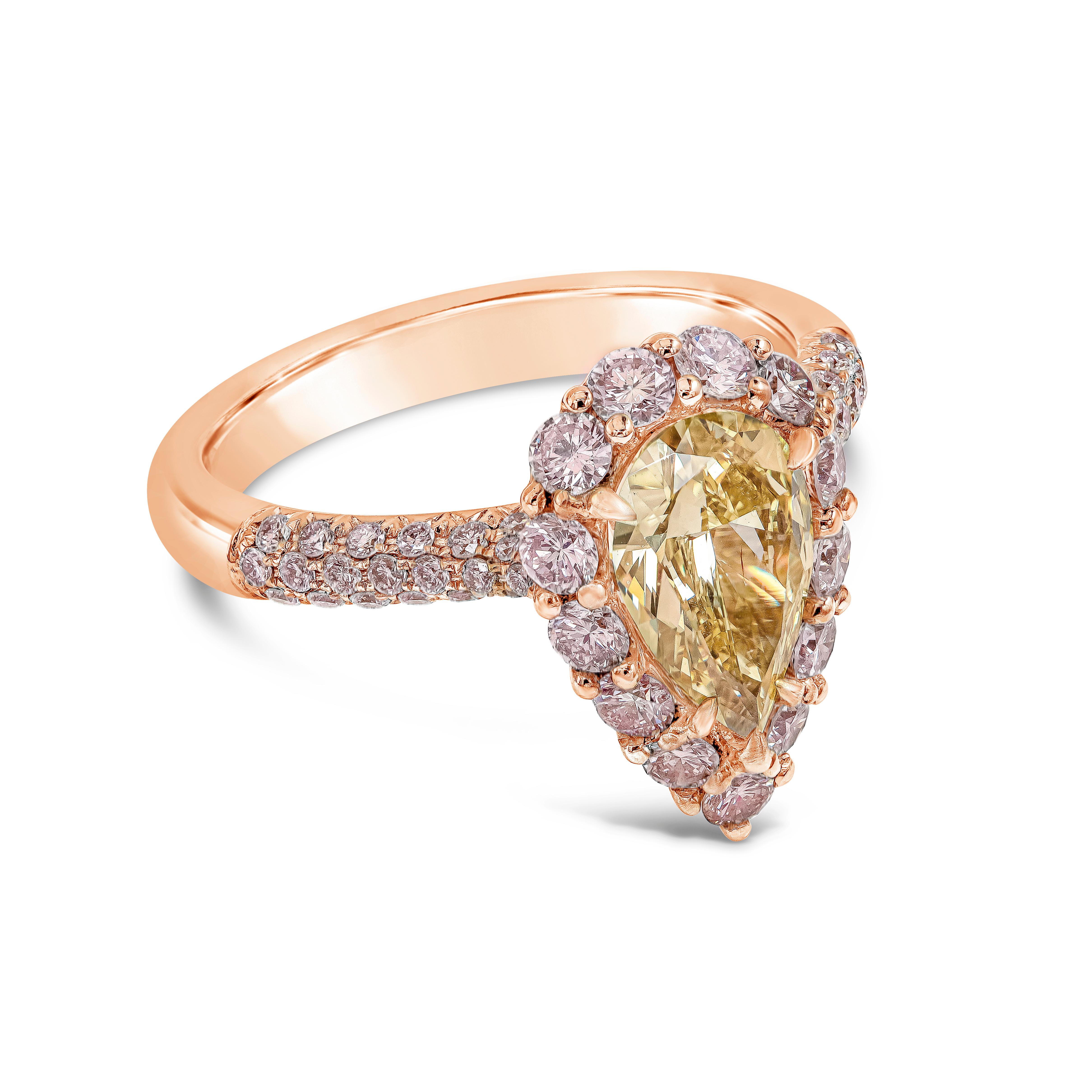 Features GIA certified pear-shape diamond weighing 1.19 carat total. The diamond is Fancy Intense Yellow and SI2 clarity. The center diamond surrounded by a single row of natural pink round brilliant diamonds. This composition accented by pave set