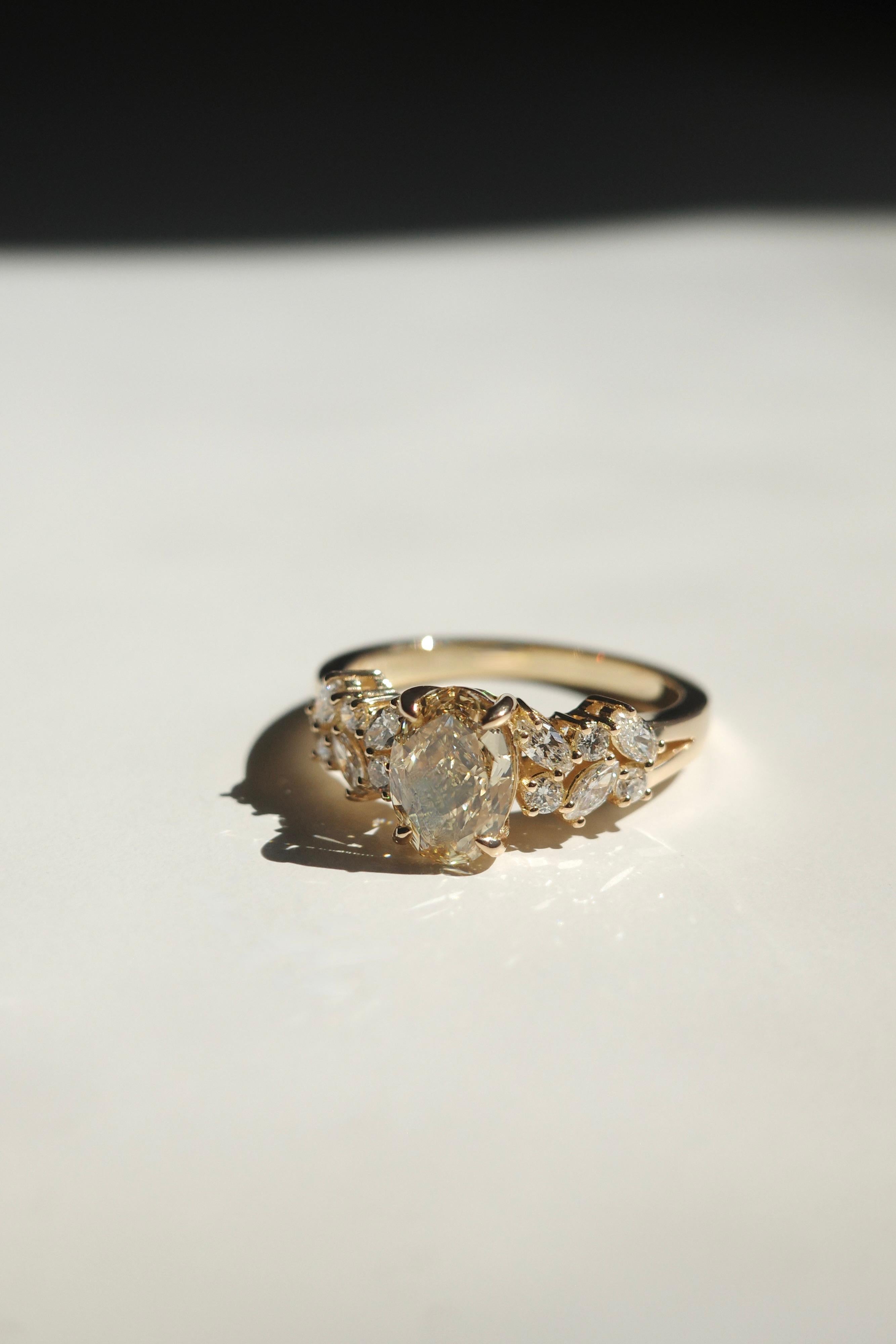 For Sale:  GIA Certified 1.19ct Oval Fancy Yellow Diamond and Marquise Diamond Ring 2