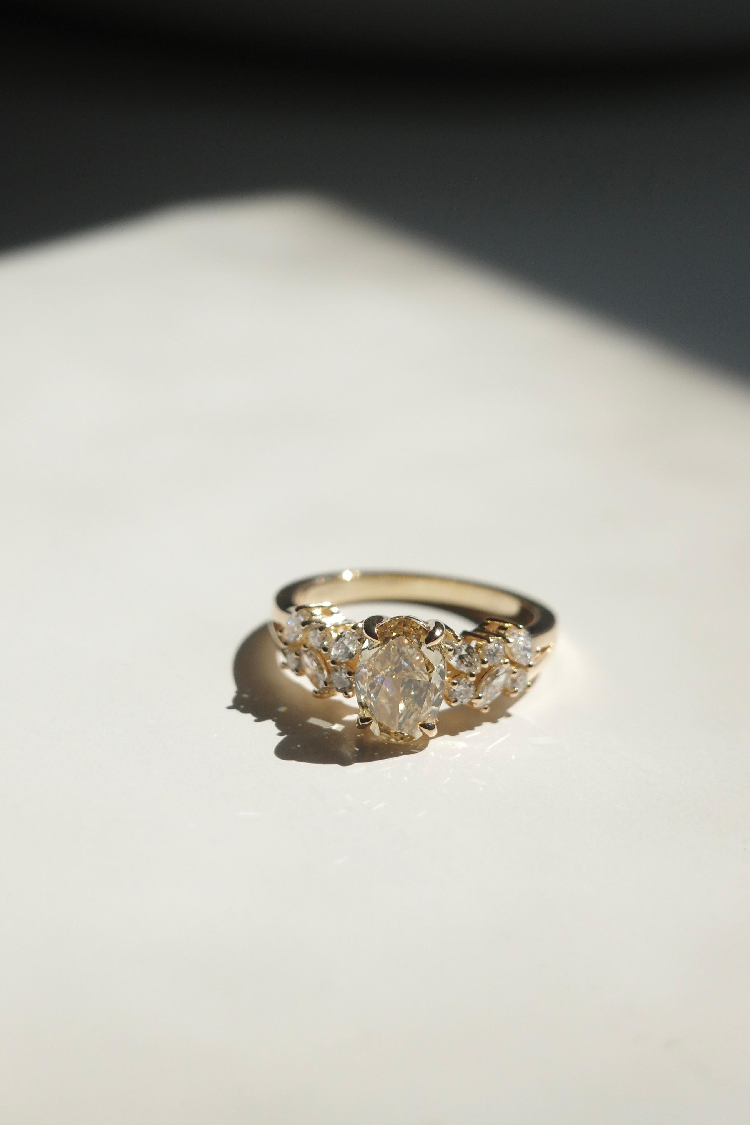 For Sale:  GIA Certified 1.19ct Oval Fancy Yellow Diamond and Marquise Diamond Ring 3