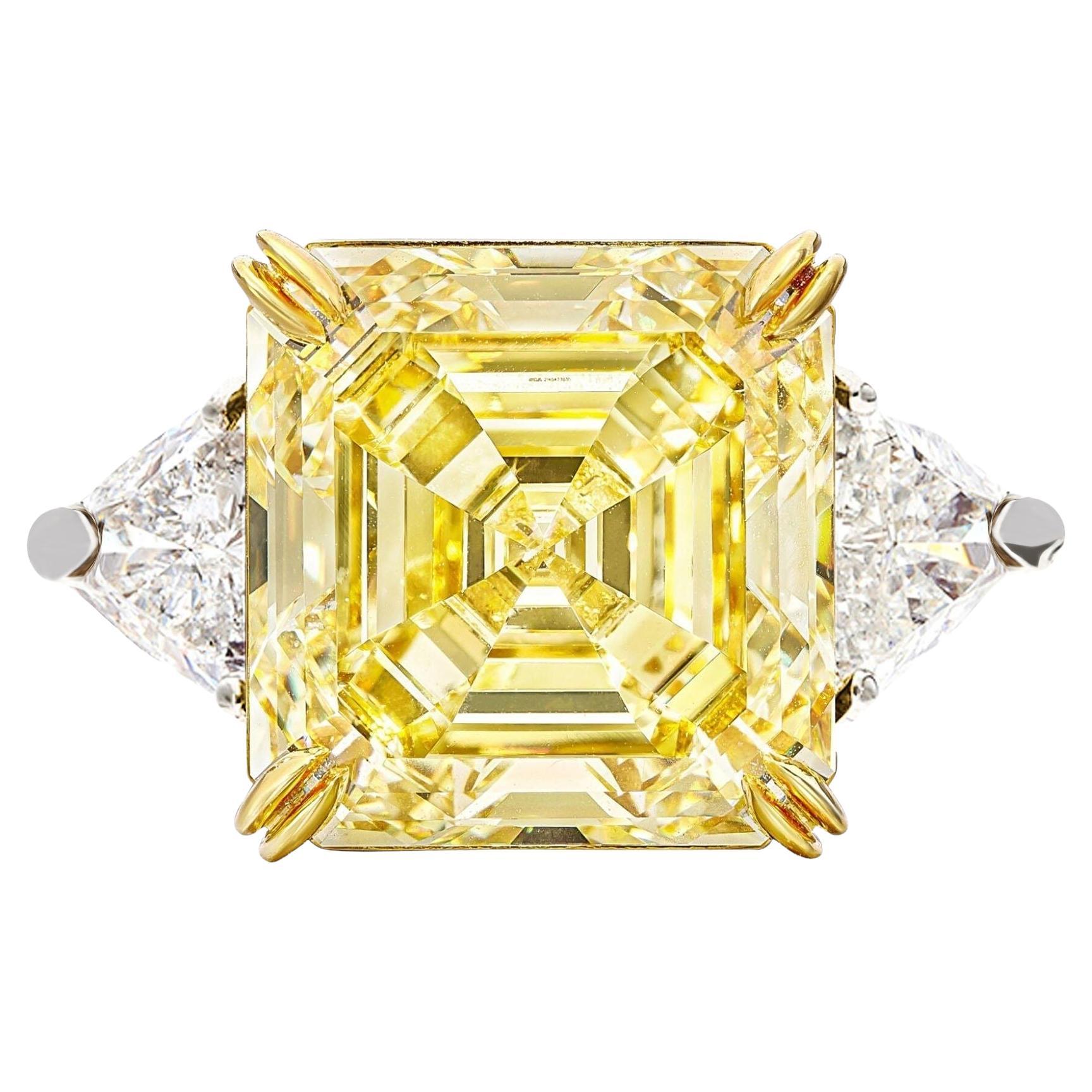 GIA Certified 12 Carat Emerald Cut Fancy Yellow Diamond Trillion side Ring