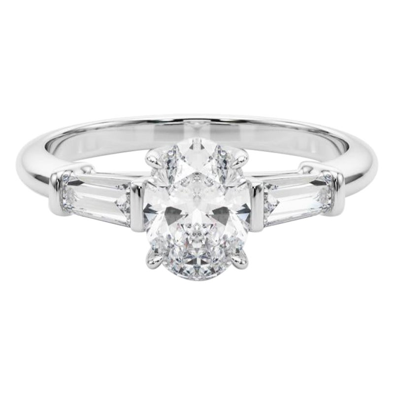 Bague à trois pierres en diamant ovale et baguette de 1,2 carat certifiée par le GIA en vente
