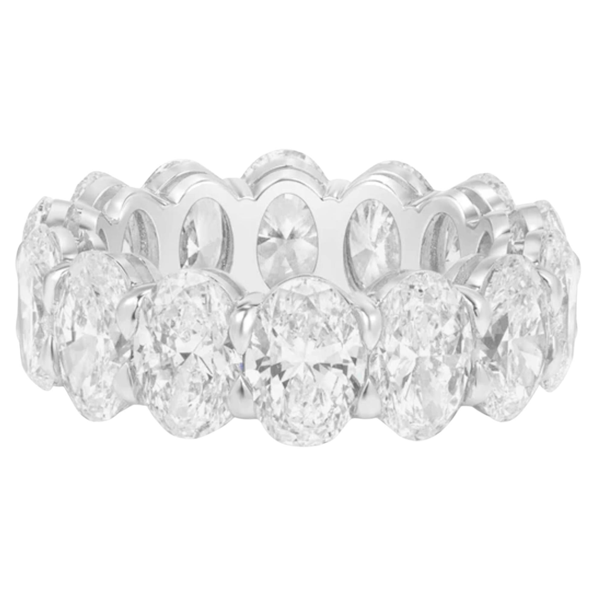 Platinum Oval Diamond Eternity Band, a stunning symbol of timeless elegance. This exquisite band features 12 GIA-certified oval-cut diamonds, totaling an impressive 12.10 carats, set in luxurious platinum. The diamonds range from D to F in color and