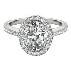 Bague à diamant en or blanc 18 carats certifiée GIA de 1,2 carat avec halo ovale et panier filigrané