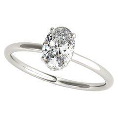 Anillo de diamantes de oro blanco con halo oculto ovalado de 1.2 quilates certificado por GIA