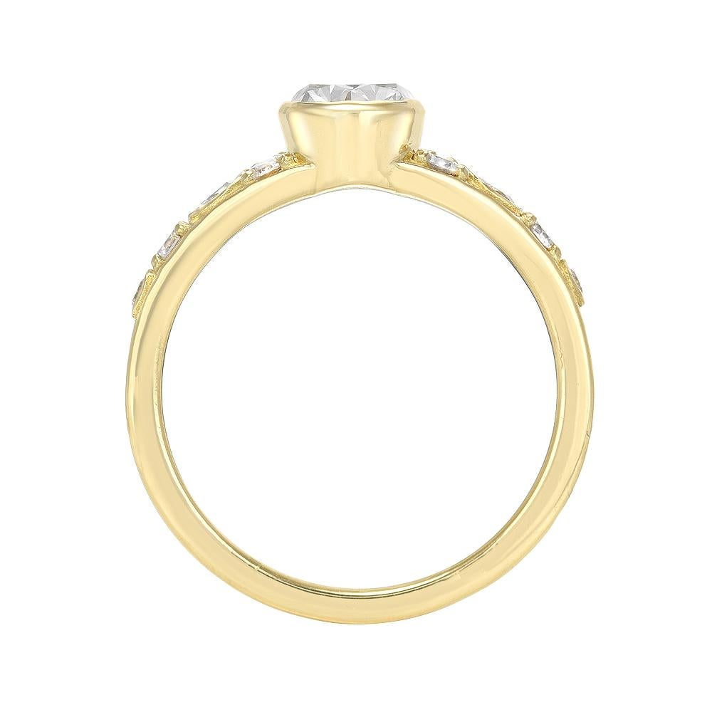 1.2 CARAT OVAL SHAPE DIAMOND RING 

This minimal but stunning piece features a classical 1.2 ct oval shape diamond in G color SI 1 GIA certified. The center stone is set in a  thin gold bezel, and band sparkles with pave and bezeled round diamonds.