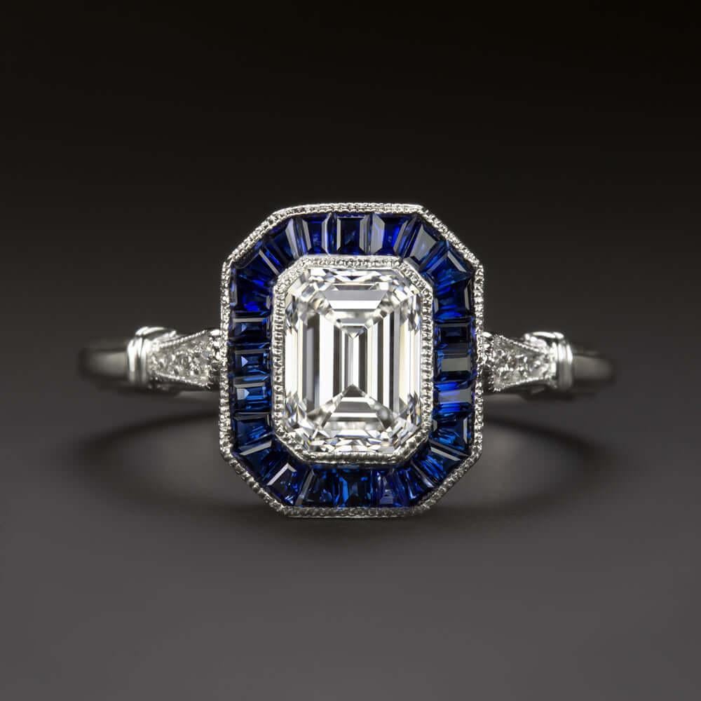 high quality 1.20 carat natural diamond set off by a rich blue sapphire halo. The GIA I VS1 diamond is beautifully white and exceptionally clean, a gorgeous stone that is sure to become an heirloom! Eye-catching and classically fashionable, the