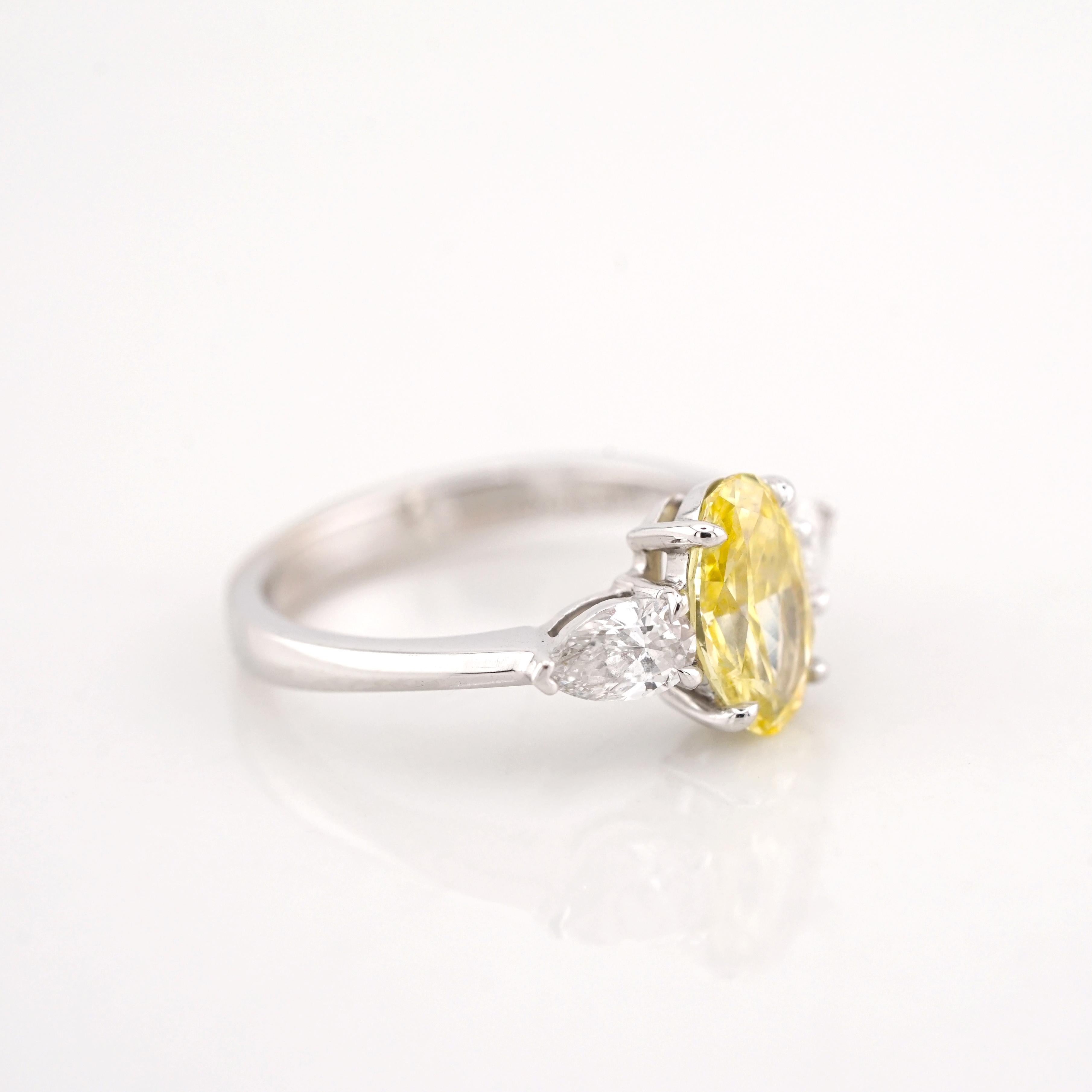 Contemporary GIA Certified 1.20 Carat Fancy Yellow Oval Cut Diamond 18K Gold Ring For Sale