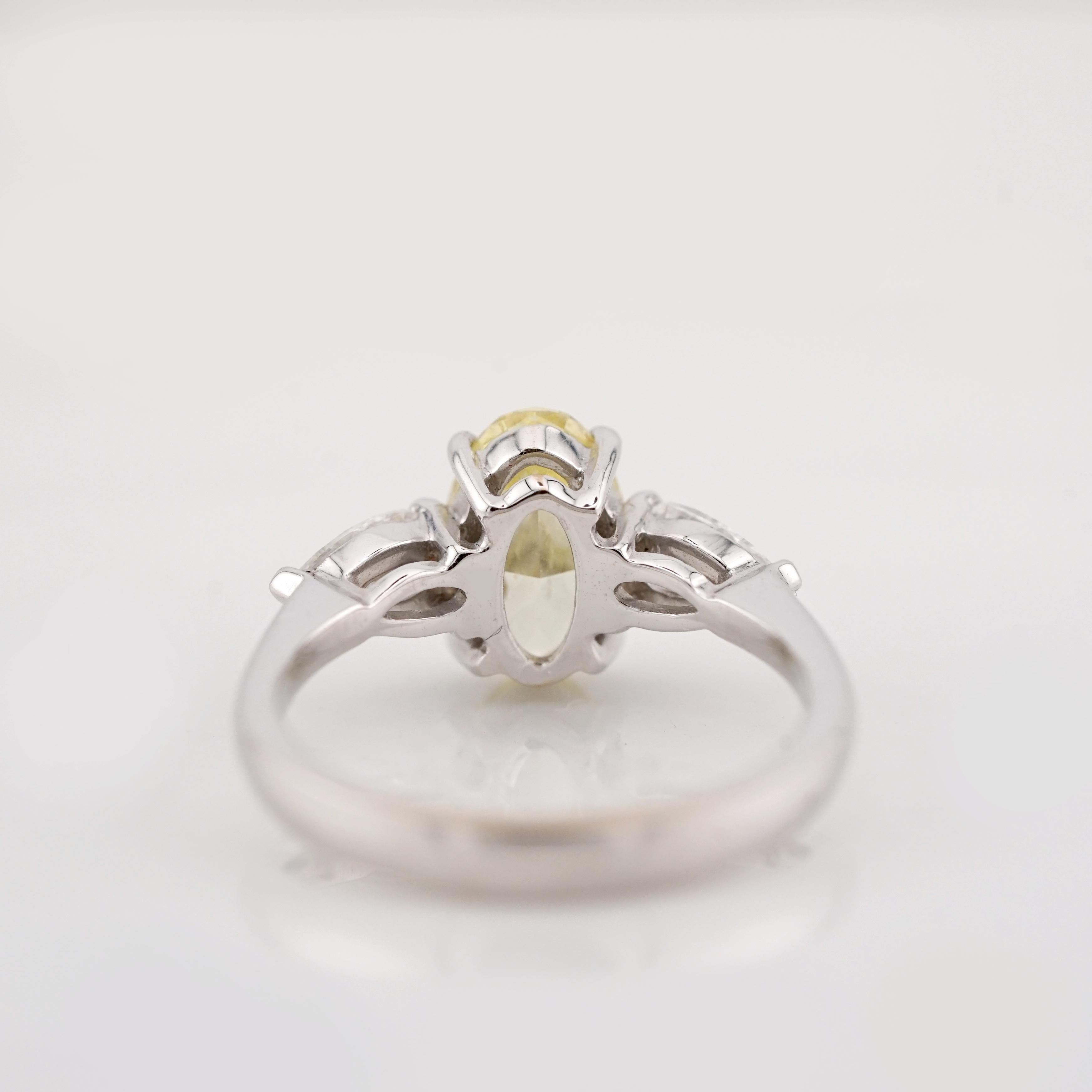 GIA Certified 1.20 Carat Fancy Yellow Oval Cut Diamond 18K Gold Ring In New Condition For Sale In Chicago, IL