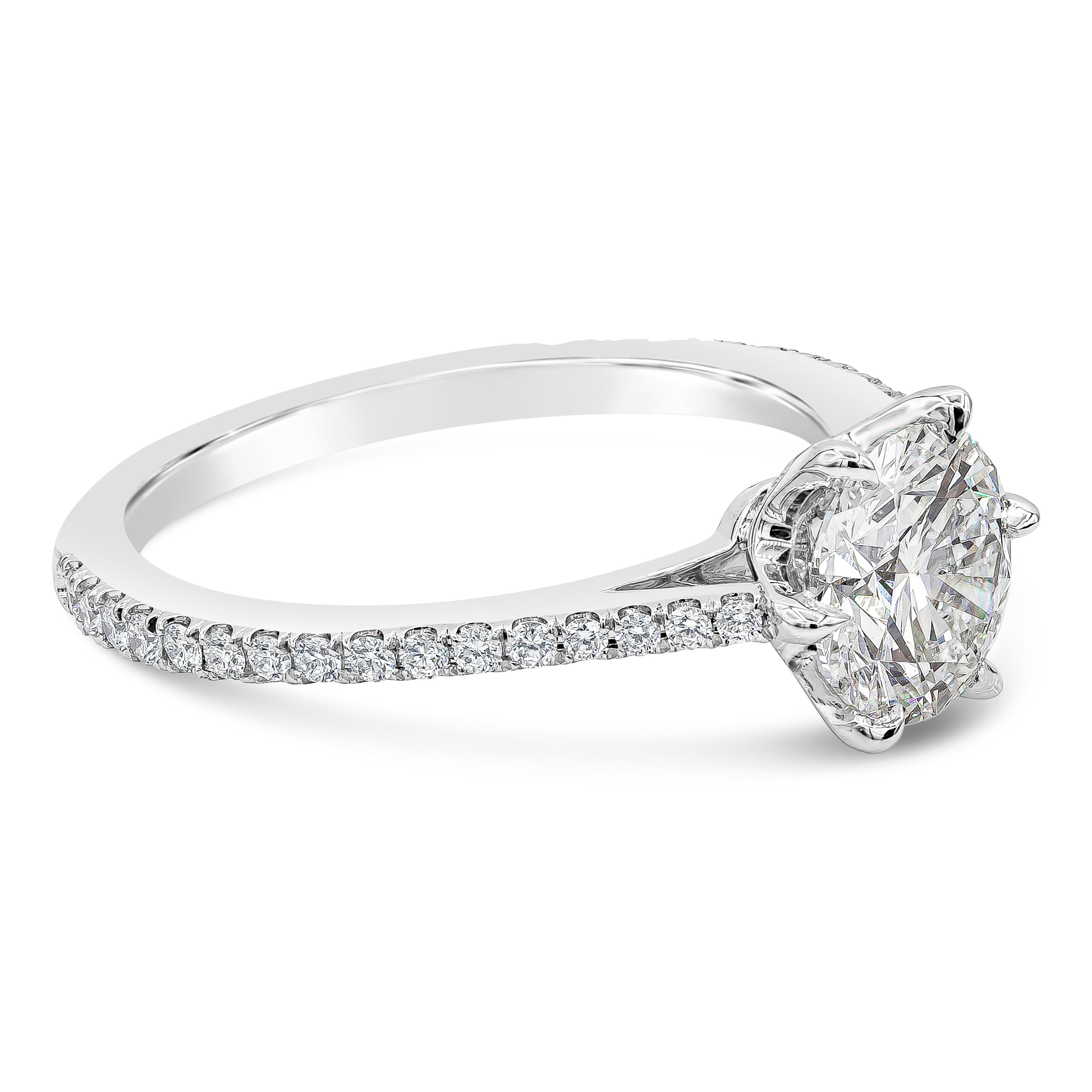 Timeless engagement ring style showcasing a 1.20 carats round brilliant diamond certified by GIA as G color, SI2 in clarity. Set in a six prong setting made in platinum. The mounting is accented with round brilliant diamonds weighing 0.37 carats