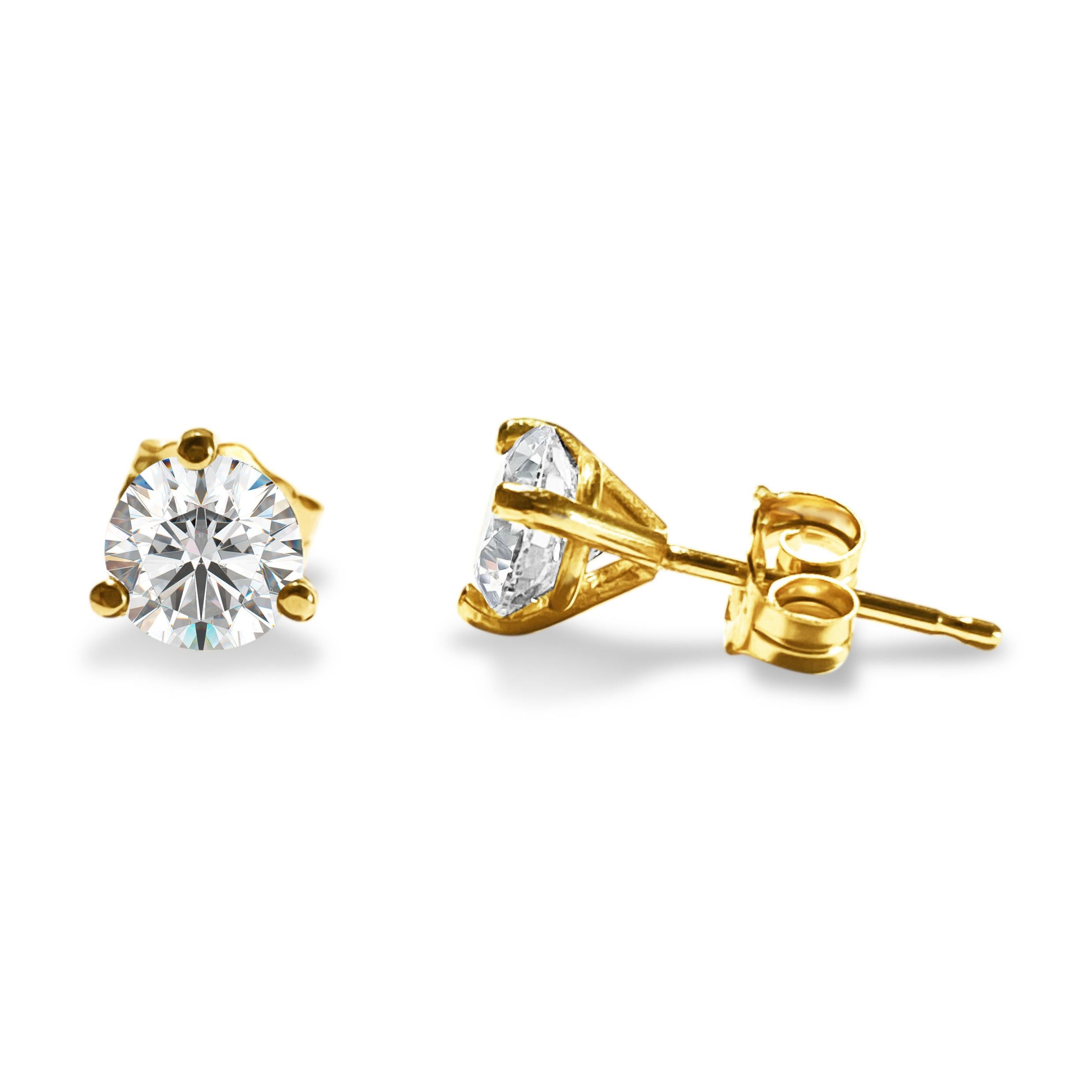 Metal: 14k yellow gold
Diamonds: 1.20 cwt
Clarity: VVS1
Color: H 
Round brilliant cut
Diamonds set in 3 prong martini style push back studs
100% natural earth mined diamond studs

Certified by GIA graduate gemologist, AGI New York. 

Beautiful