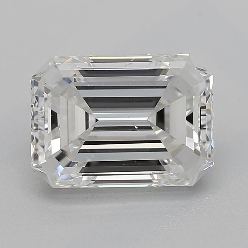 Handcrafted in New York, this exquisite diamond ring showcases a captivating emerald H VS2 1.21 center stone, brilliantly set in a classic four-prong setting that elevates its radiant beauty. The ring is elegantly adorned with shimmering tapered