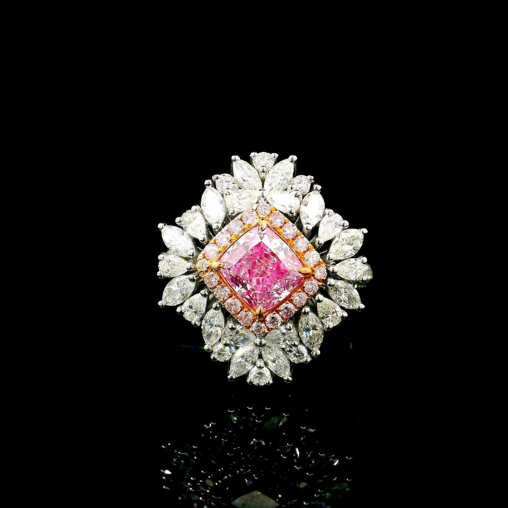 18kt white gold ring with diamonds
  
  Gold colour & karat: White gold 18kt
  Weight: 7.34 grams
  
  Set with-
  Stone type: Diamonds
  Shape: Cushion
  Carat: 1.21 ct
  Colour: Faint Pink
  Clarity: SI2
  
  Surrounding Stones: Diamonds
 1) White