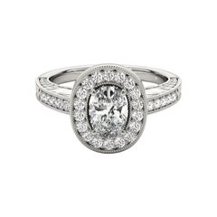 Anello con diamante ovale aureolato inciso e traforato in platino, certificato GIA da 1.21 carati