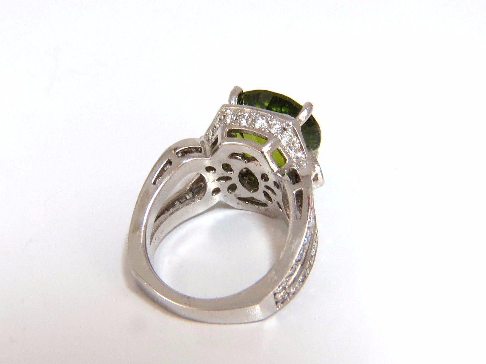 Round Cut Peridot Split Shank Halo

GIA Certified 10.15ct. Natural Peridot ring.

Round brilliant cut, clean clarity & Transparent.

Classic Green Color

12.94 X 13.10 X 9.25mm

GIA # 1172094726 - to accompany

2.00ct Side round diamonds 

Full cut