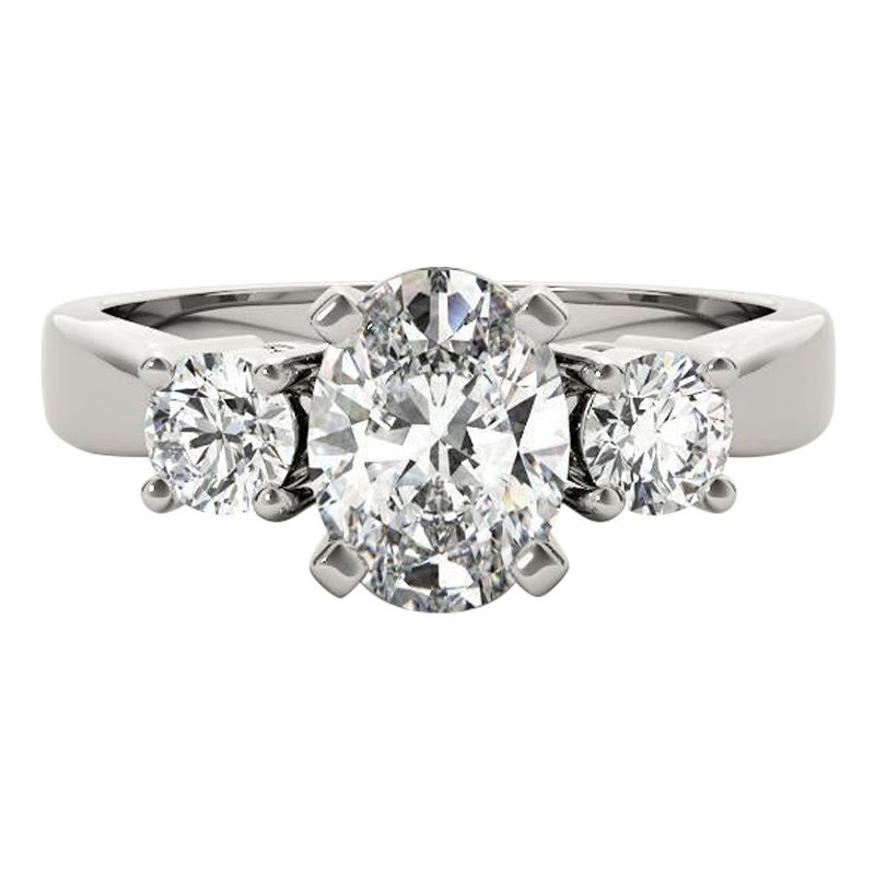 GIA Certified 1.22 Carat Oval & Round Three-Stone  Bague en diamant