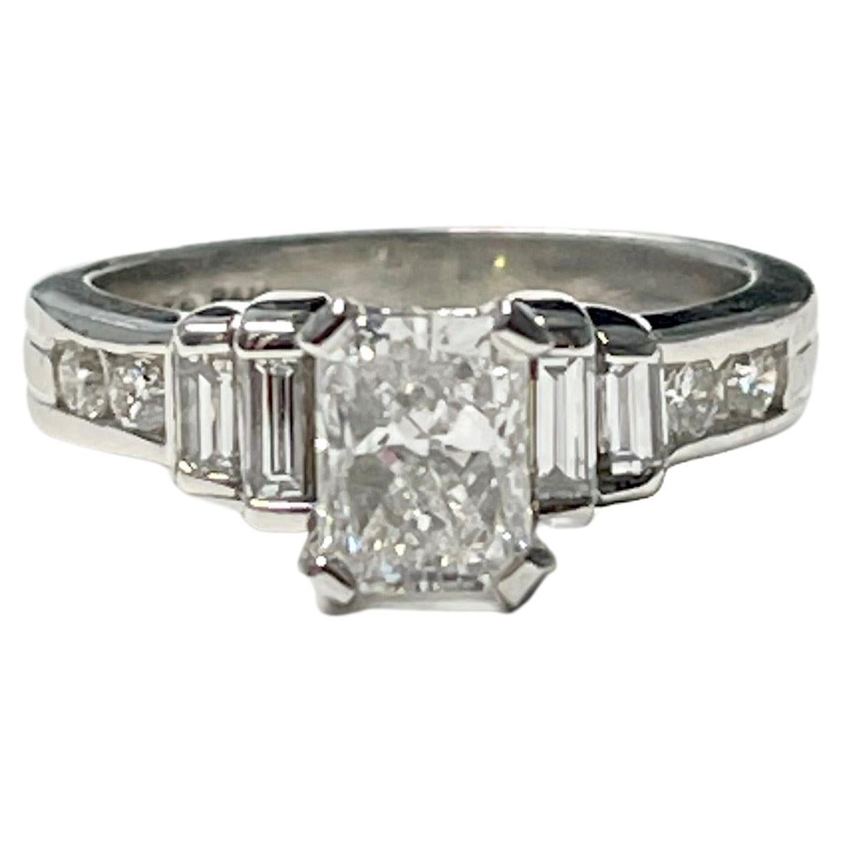 GIA certified 1.23 carat radiant cut diamond engagement ring handcrafted in platinum.
The details are as follows : 
Radiant cut diamond : 1.23 carat ( F color and SI2 clarity ) 
Diamond weight : 0.50 carat 
Measurements : 6.76x5.09x3.98 mm 
Ring