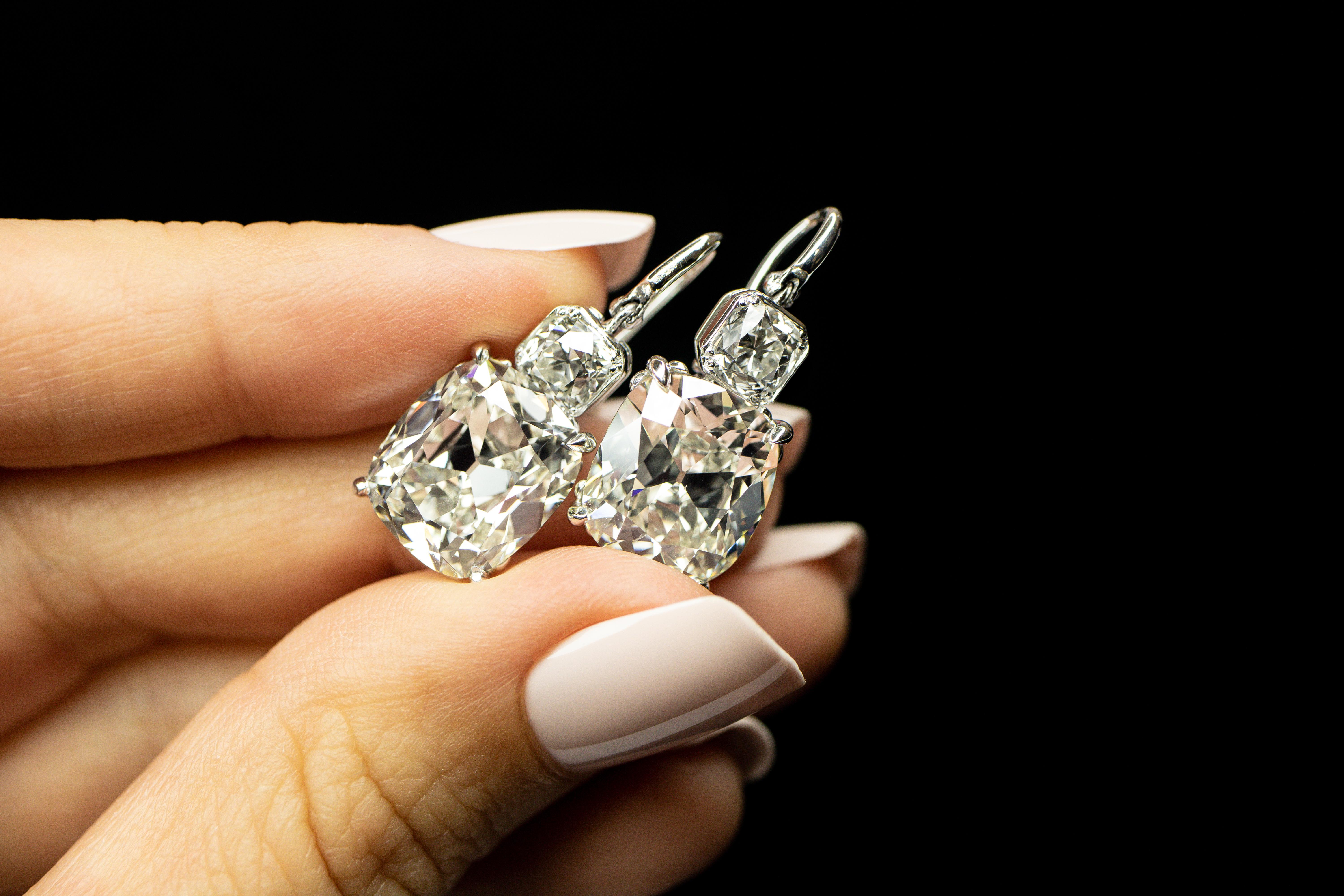 Vintage Oscar Heyman Earrings from Circa 1920’s. This exquisite is something you won’t see replicated and will feel proud to own and wear. 

12.41ct total of Antique Cushion cut diamonds masterfully set in platinum. 

Set in 18k White gold 6.06ct CU