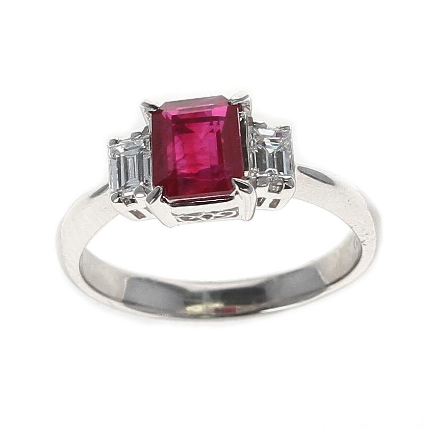 A GIA Certified 1.25 Carat Emerald-Cut Burma Ruby Three-Stone Diamond Ring in Platinum. Diamond Weight: 0.36 carats. Total Weight: 4.29 grams. Ring Size US 5.75. GIA Certificate Available. 
