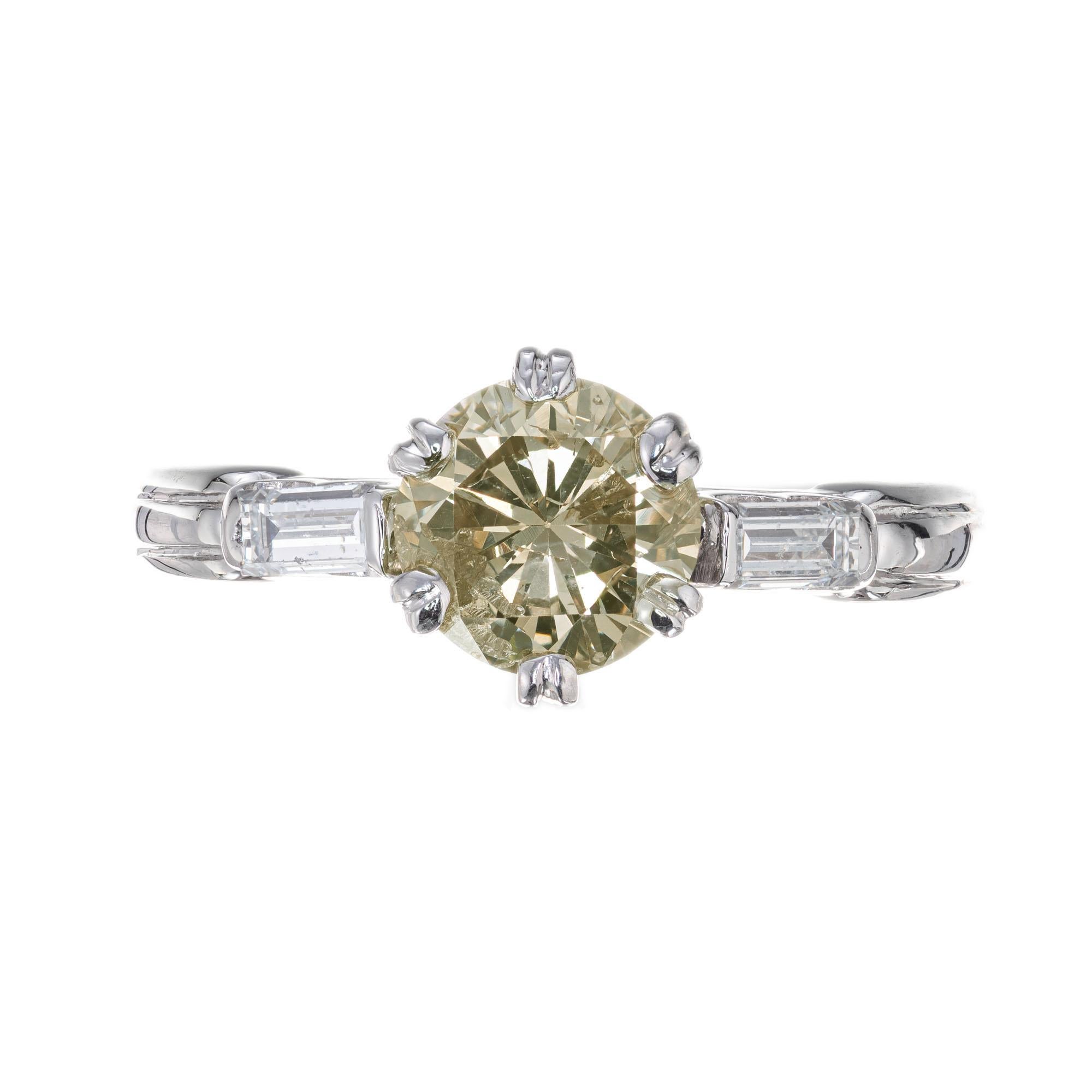 1940's diamond engagement ring. GIA certified natural light brown center diamond with two baguette cut side diamonds in a platinum six prong, three-stone setting. Natural color GIA certified light brown diamond

1 round transitional cut light brown