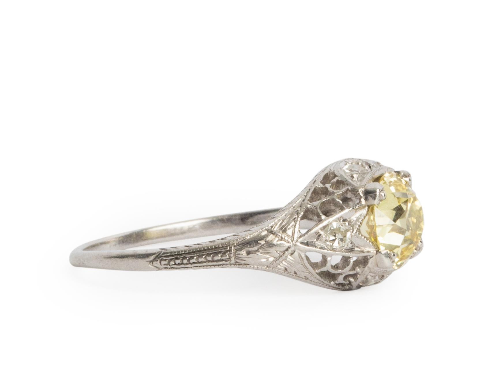 Ring Size: 8
Metal Type: Platinum  [Hallmarked, and Tested]
Weight:  3.5 grams

Center Diamond Details:
GIA REPORT#2201883948
Weight: 1.25 carat
Cut: Old European Brilliant
Color: Fancy Yellow, Natural
Clarity: VS1

Side Diamond Details:
Weight: .12