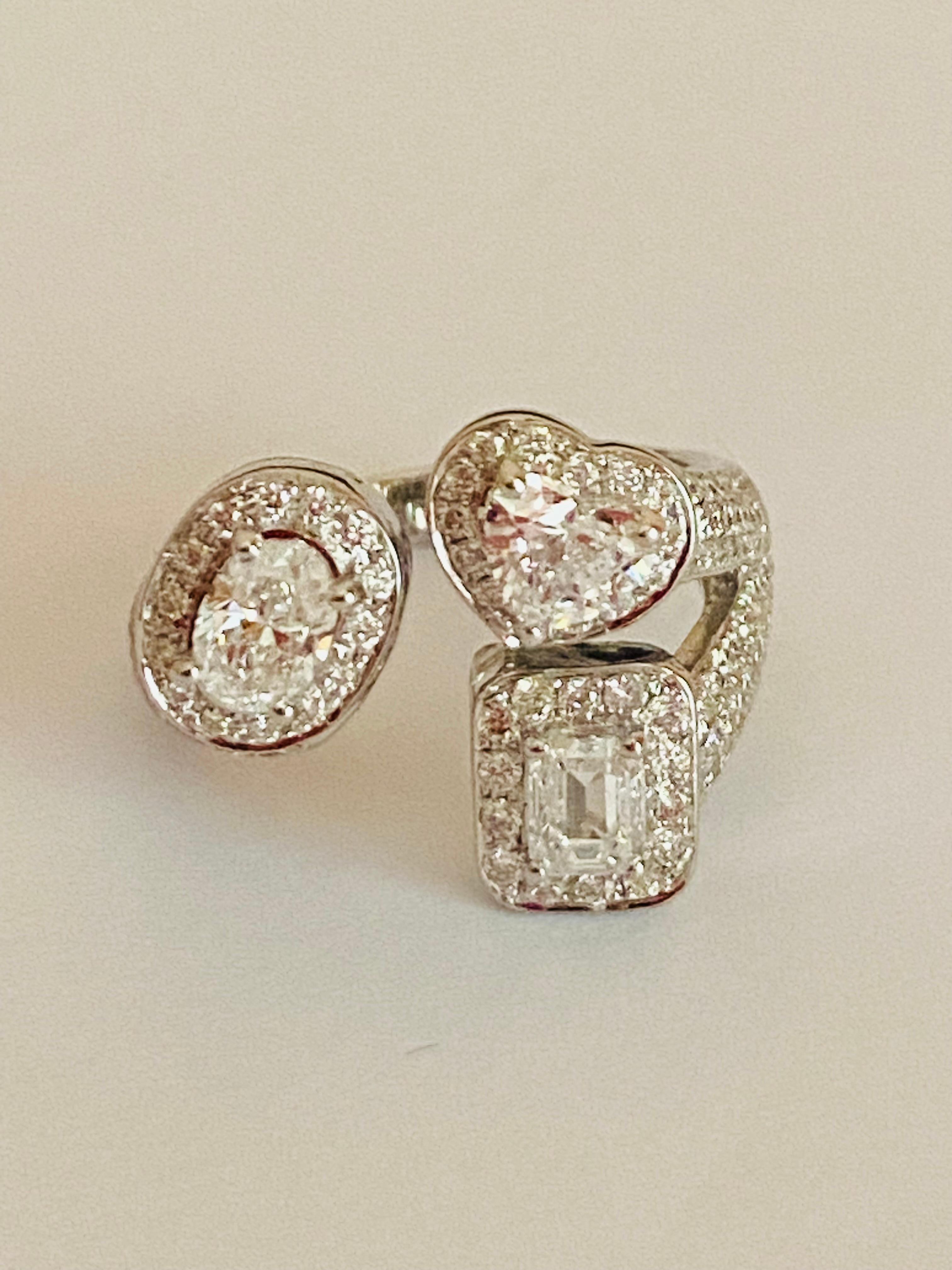 An amazing modern design from contemporary collection, so stunning, ideal for all events, so sophisticated and elegant, by Italian designer.
Ring come in 18K gold with 3 pieces of GIA certified Natural Diamonds, in special cut. One piece is in