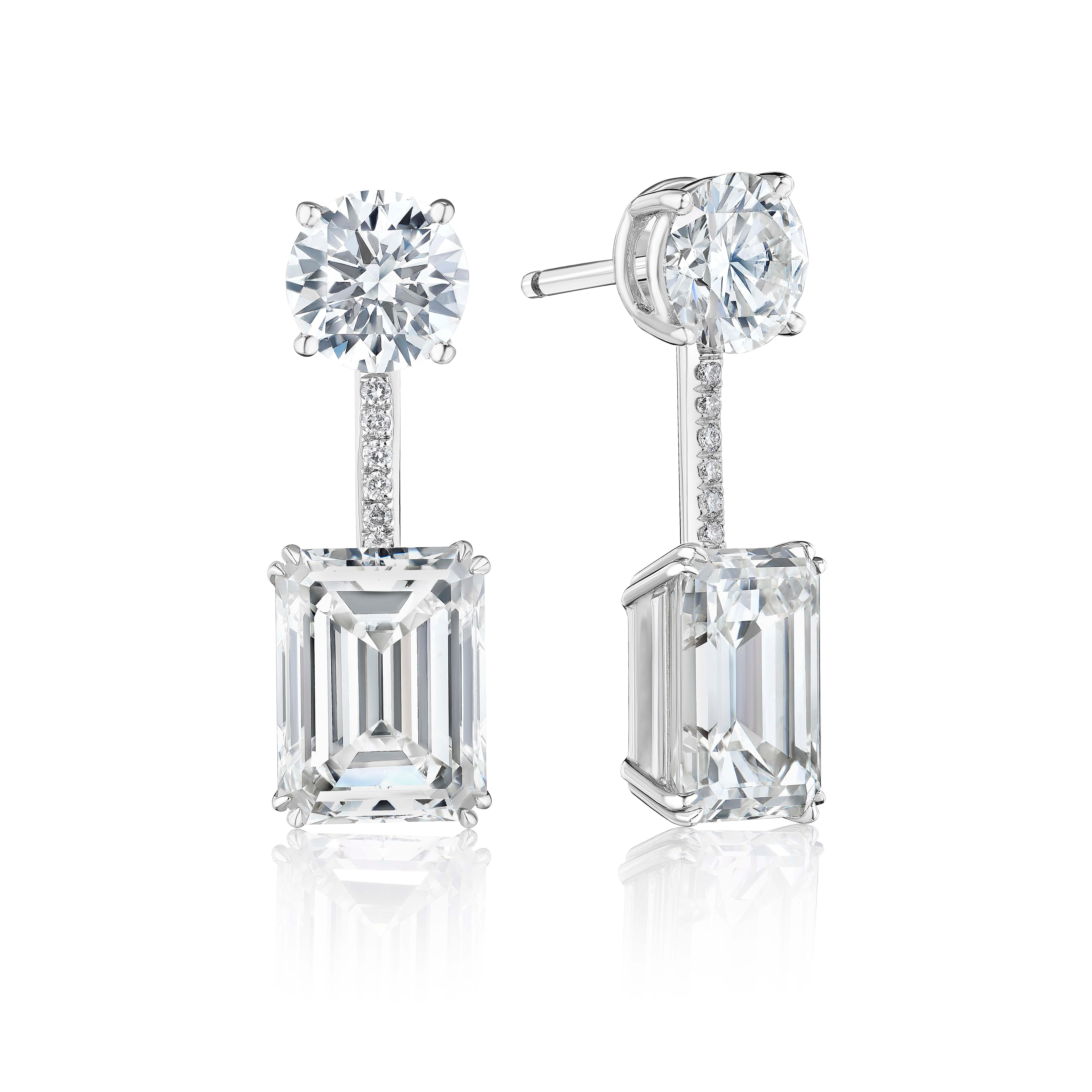 Matched pair of 10.0 carat Emerald Cut Diamond Stud Earrings Set in Platinum.
Suspended from Diamonds weighing 2.50 Carats.
Stones are of J color and VS Clarity.
GIA Certified.

Can be made as a push back, screw back or omega backs.