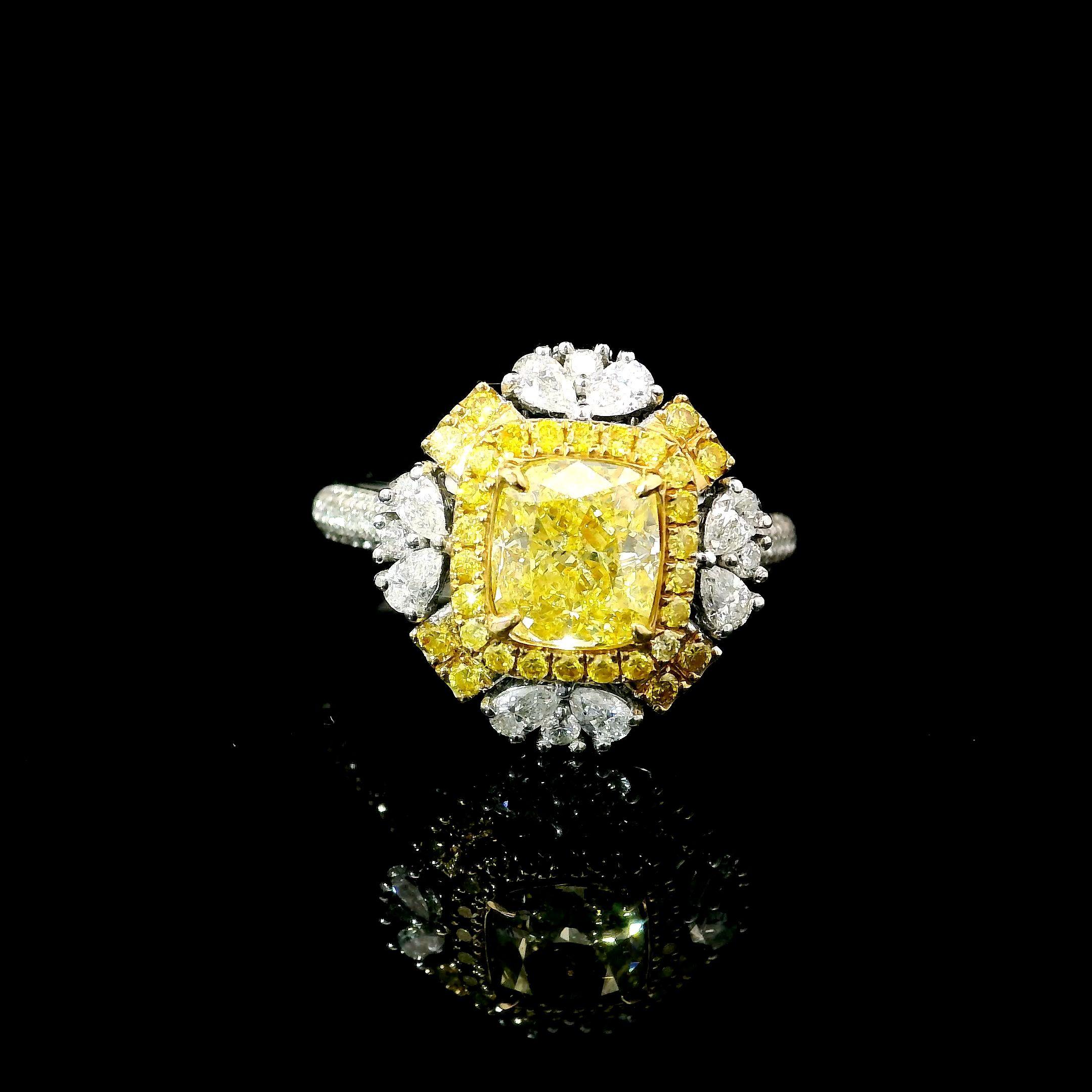 18kt white gold ring with diamonds
  
  Gold colour & karat: White gold 18kt
  Weight: 5.69 grams
  
  Set with-
  Stone type: Diamonds
  Shape: Radiant
  Carat: 1.26
  Colour: Fancy Intense Yellow  
  Clarity: SI1
  
  Surrounding Stones: Diamonds
