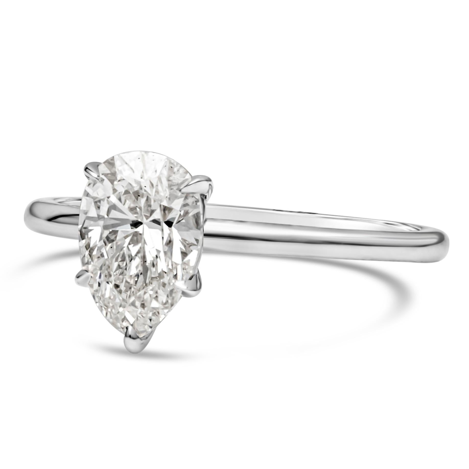 A classic and timeless engagement ring style showcasing a 1.26 carats pear shape diamond certified by GIA as I color and SI1 in clarity, set in a five prong basket setting and thin 14k white gold band. Size 6 US resizable upon request.

Style
