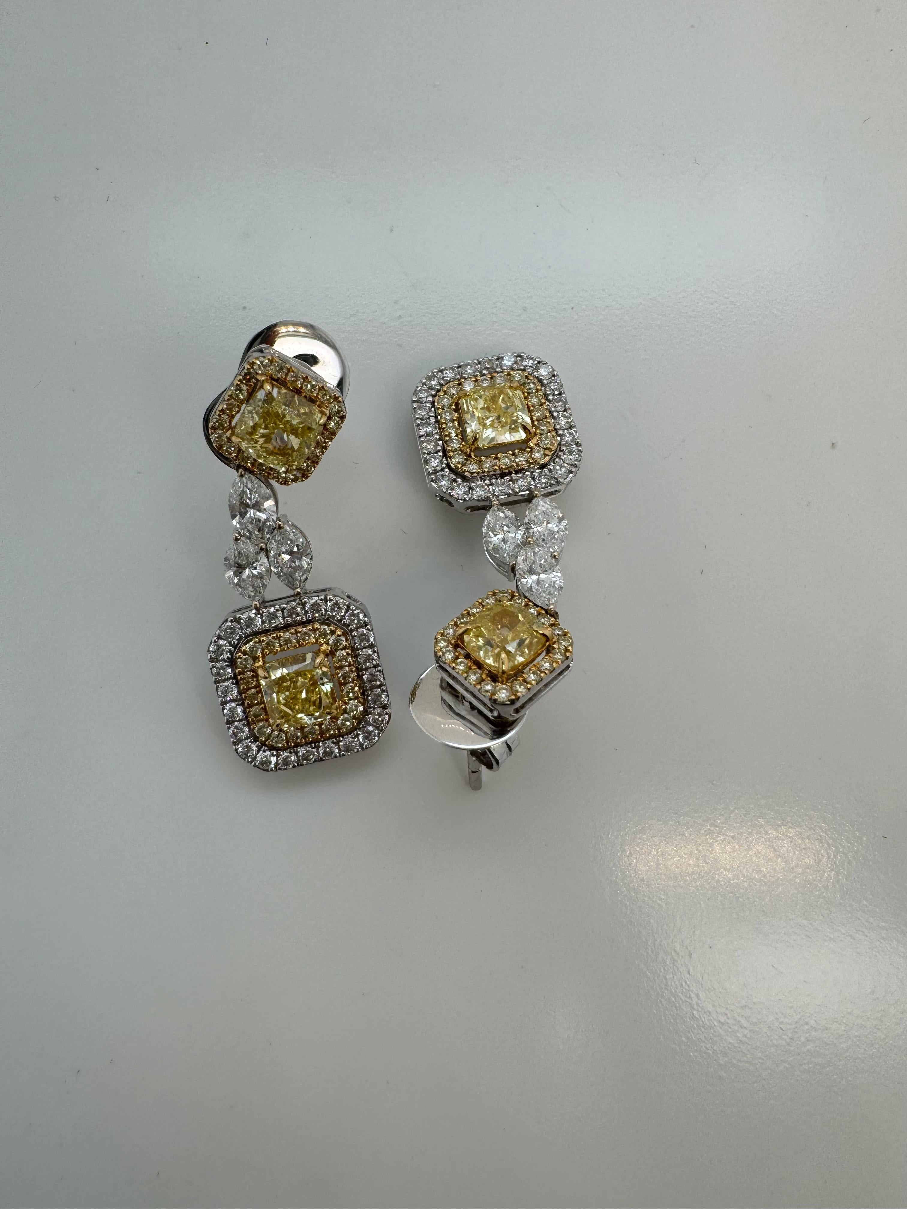 Introducing a stunning pair of earrings from Rewa Jewelry, showcasing GIA Certified Fancy Yellow diamonds that exude elegance and brilliance.

The center stones weigh 0.60 carats (GIA-6224387339) and 0.57 carats (GIA-2223324985), offering a