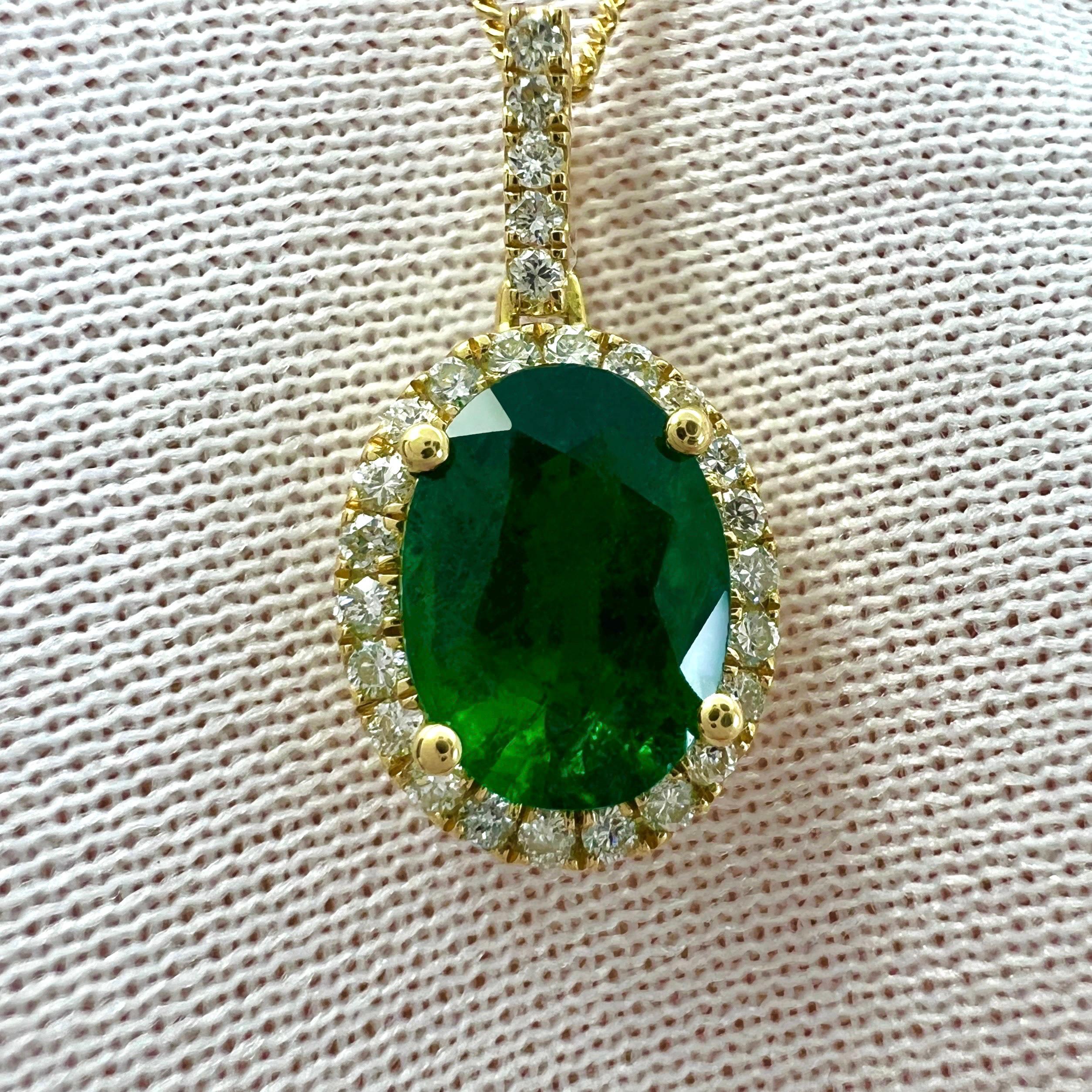 Fine Vivid Green Natural Oval Cut Emerald And Diamond 18k Yellow Gold Halo Pendant. 1.26 Total carat.

1.12ct GIA certified natural emerald with a fine vivid green colour, top grade colour quality, with an excellent oval cut.
This emerald also has