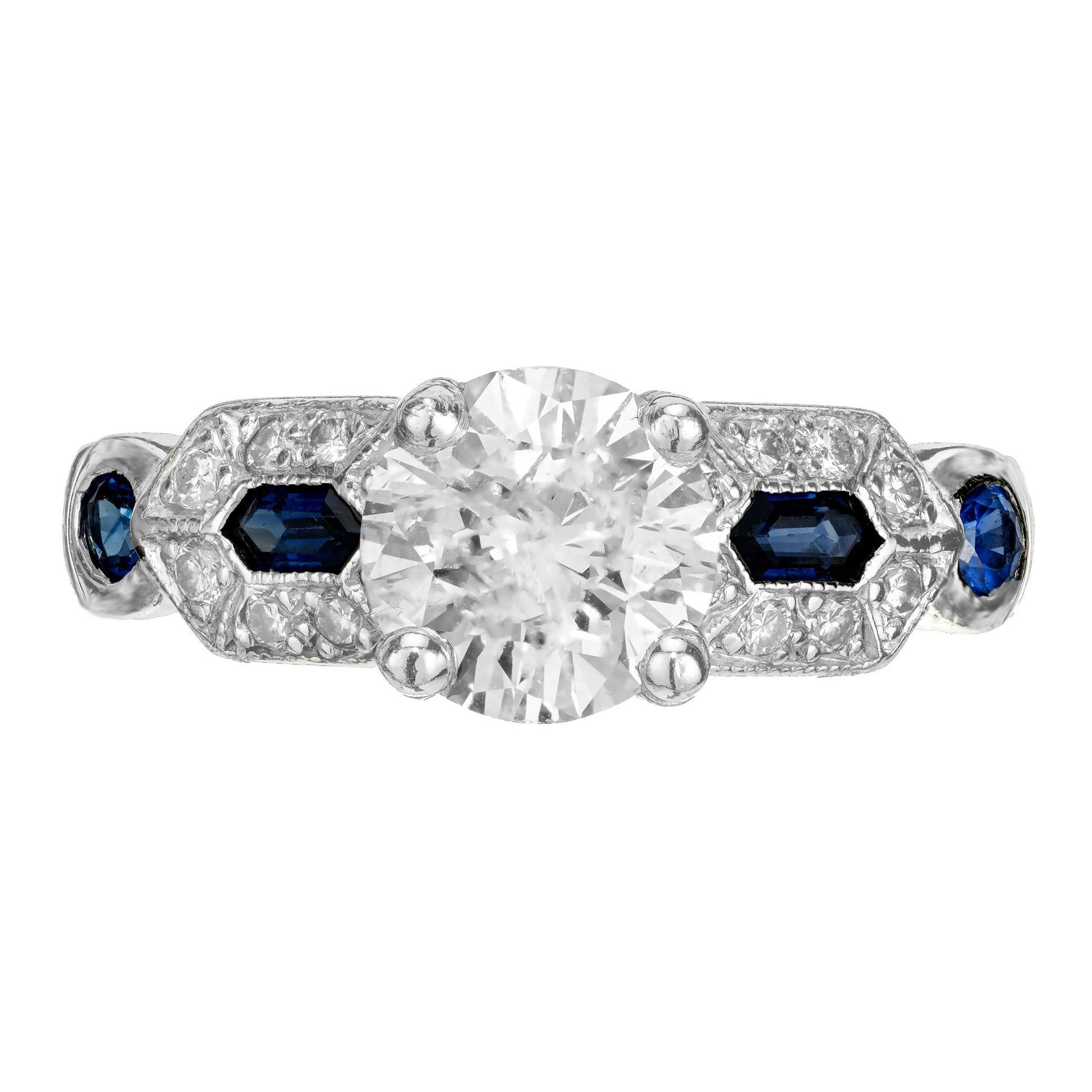 1940's Diamond platinum engagement ring. GIA certified round ideal cut center diamond in a platinum setting with two sapphires with round diamond halos and two round cut bezel set sapphire accents.  

1 Round Ideal cut diamond, approx. total weight