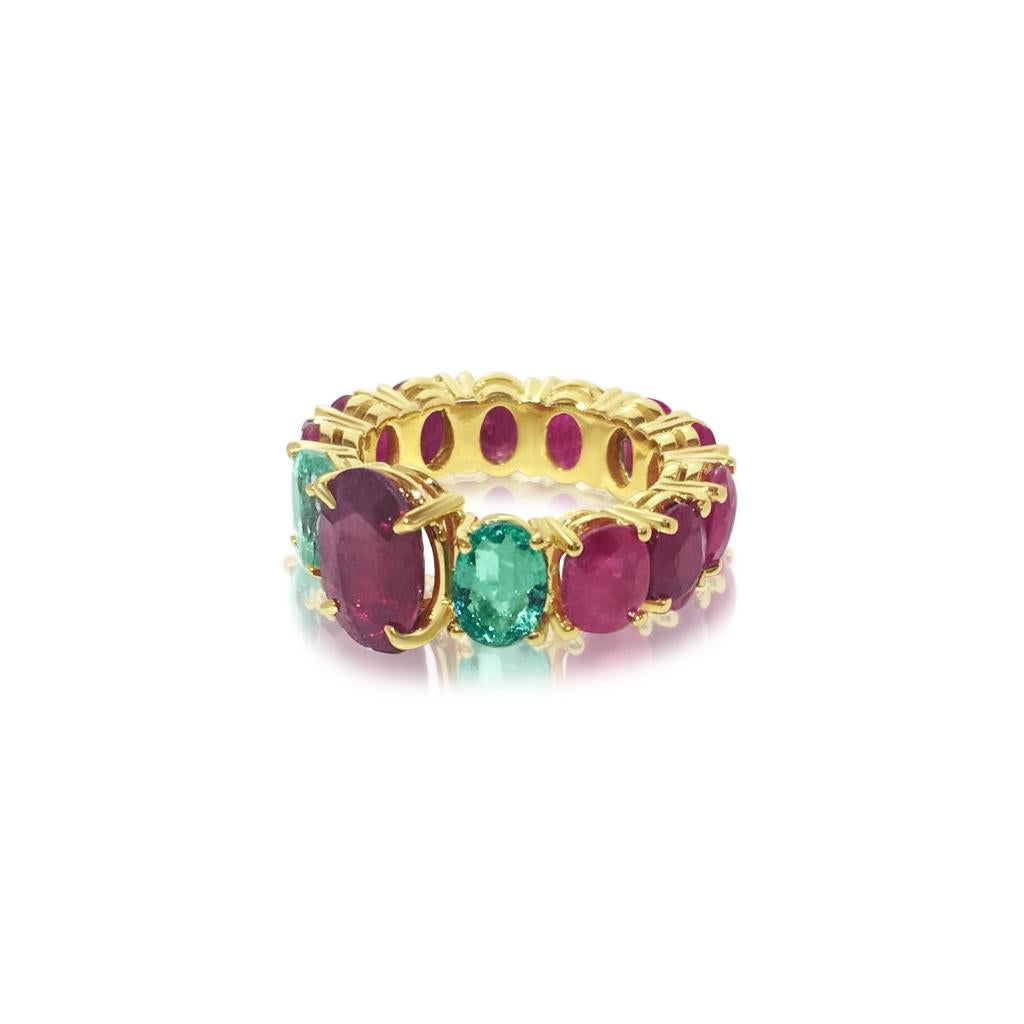 Metal: 14k Yellow Gold.

Center stone: 100% natural earth mined ruby. 3.50 carat, Oval shape

Side Stones (emerald): 100% natural earth mined Colombian Emeralds, Oval shape. 1.70 carat total. 

Side Stones (ruby): 100% natural earth mined. 7.50