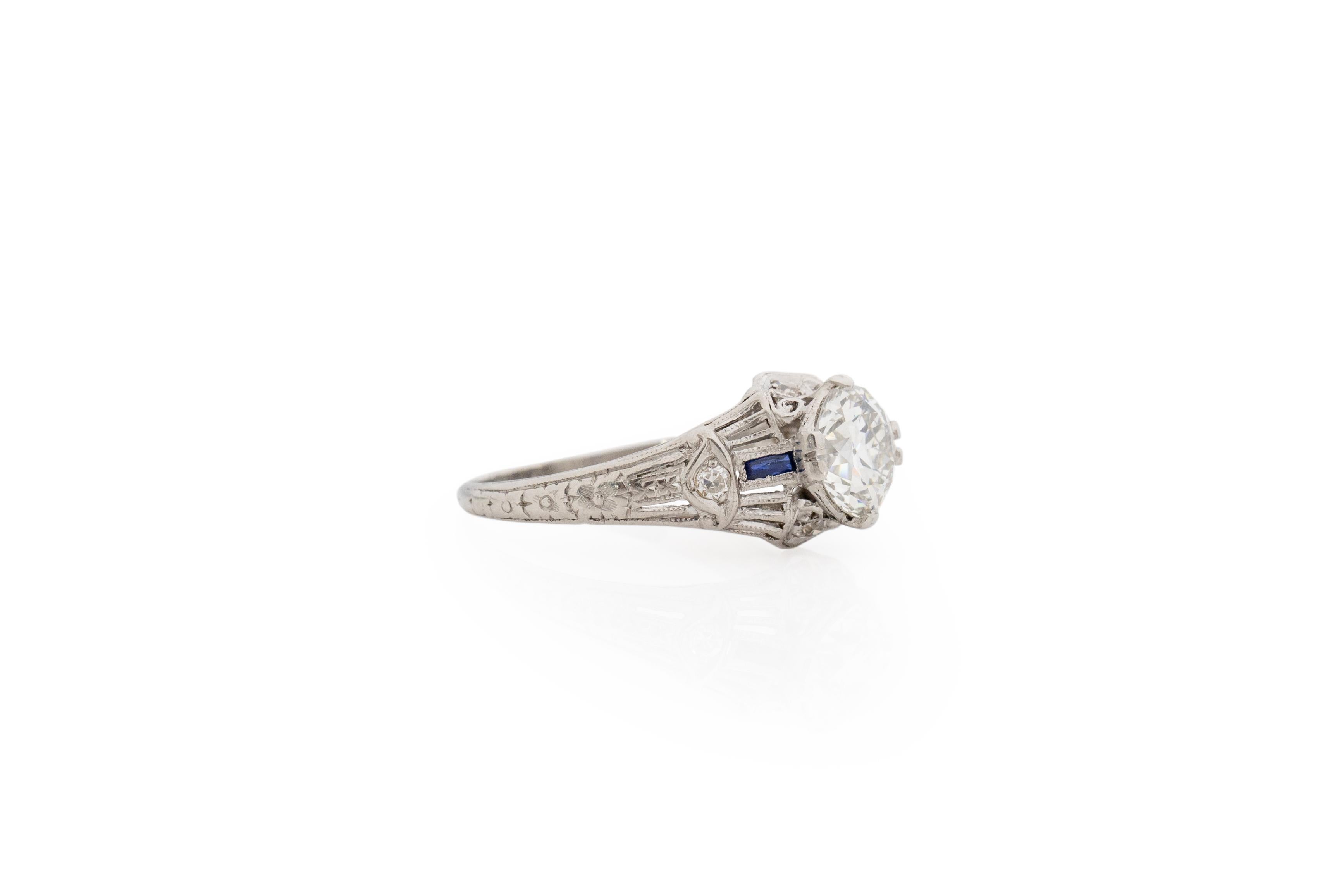 Ring Size: 6.5
Metal Type: Platinum [Hallmarked, and Tested]
Weight: 3.3 grams

Center Diamond Details:
GIA REPORT #: 2211528005
Weight: 1.28 carat
Cut: Old European brilliant
Color: I
Clarity: VS2
Measurements: 7.02mm x 6.77mm x 4.39

Side Stone