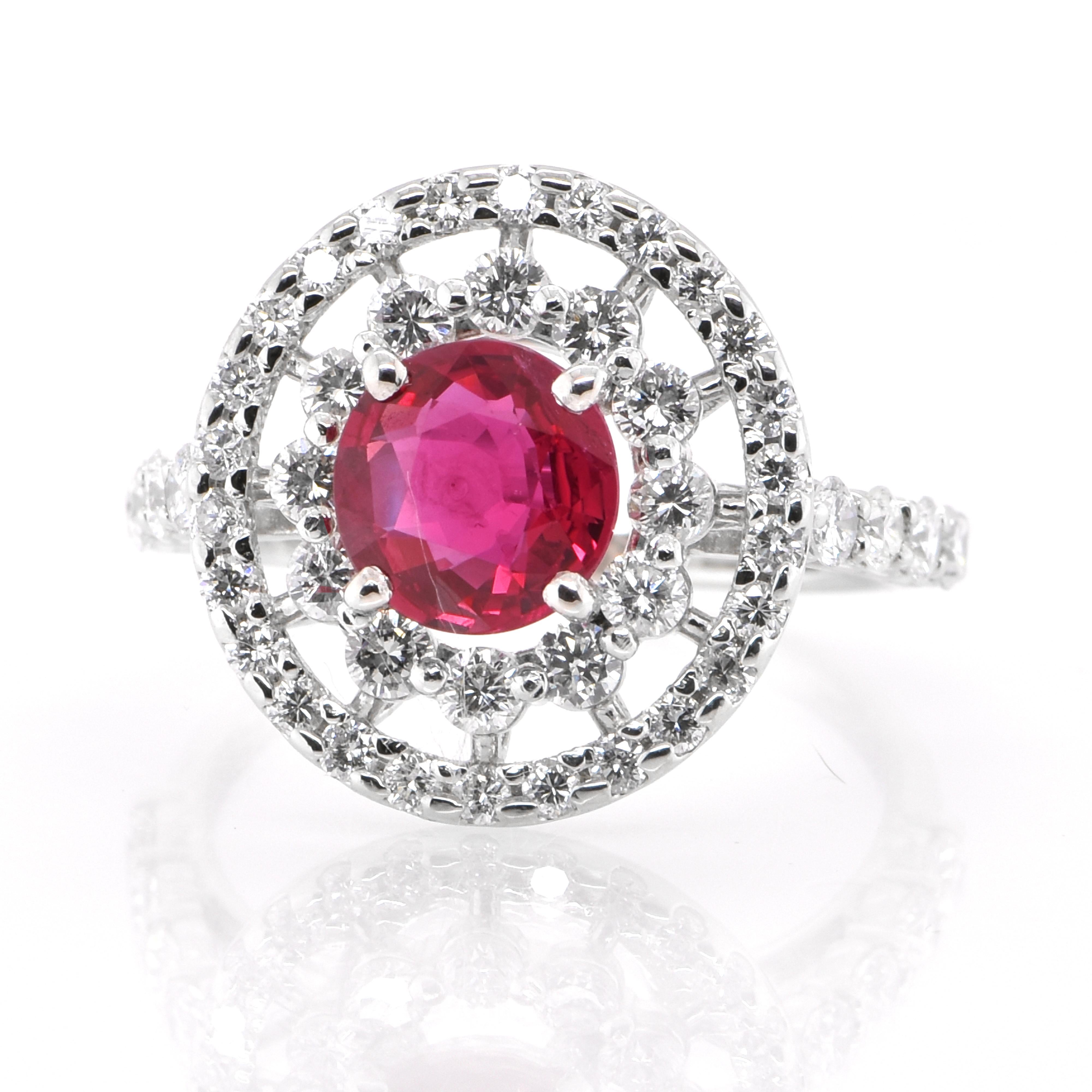 A beautiful ring set in Platinum featuring a GIA Certified 1.28 Carat Natural Siam (Thailand) Ruby and 1.18 Carat Diamonds. Rubies are referred to as 