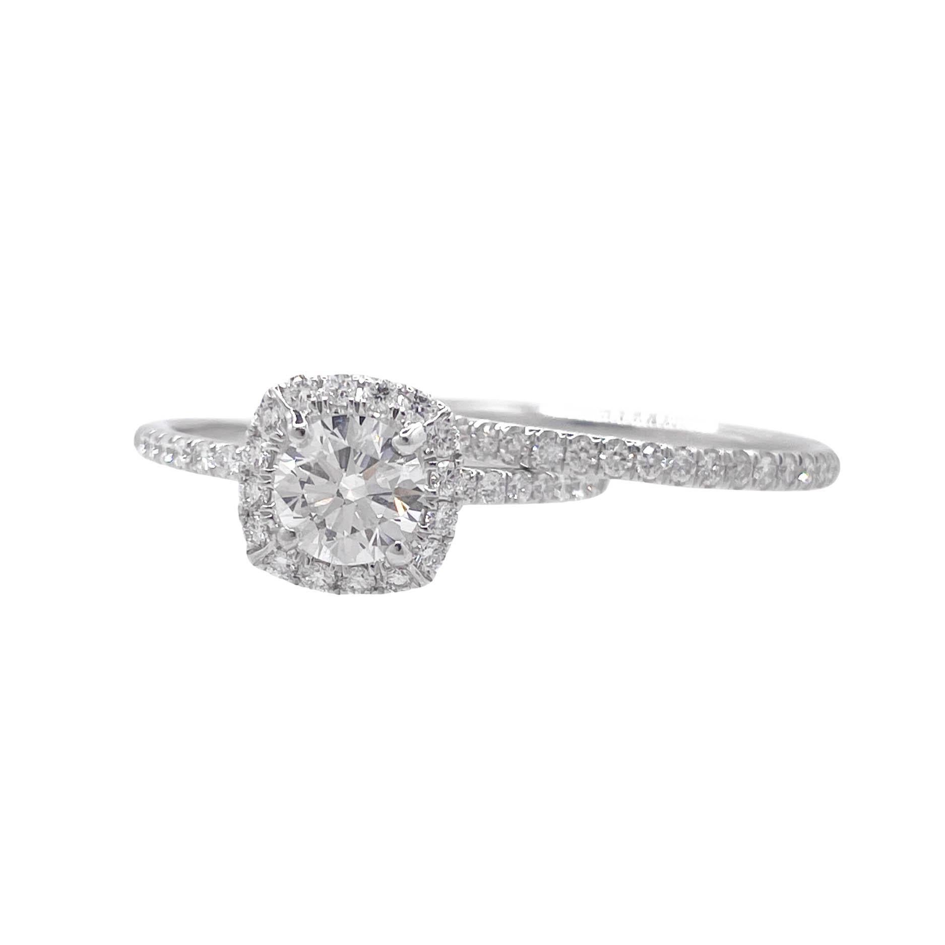 GIA Certified 1.28ctw Round Diamond Pave Halo Engagement Wedding Ring Set 
Set with GIA certified 0.90ct Round brilliant cut diamond in the center in H color and SI1 clarity; with measurements of 6.14x6.18x3.78mm. GIA report # 2446947901. The center
