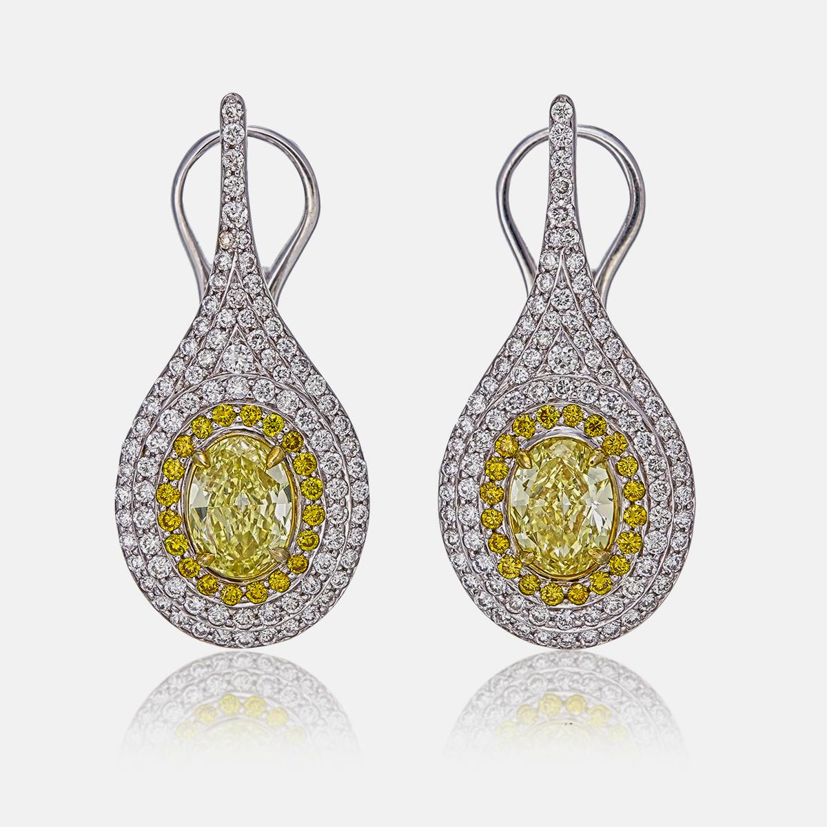 Taglio rotondo Orecchini a goccia con diamante giallo intenso da 1,29 carati certificati GIA in vendita