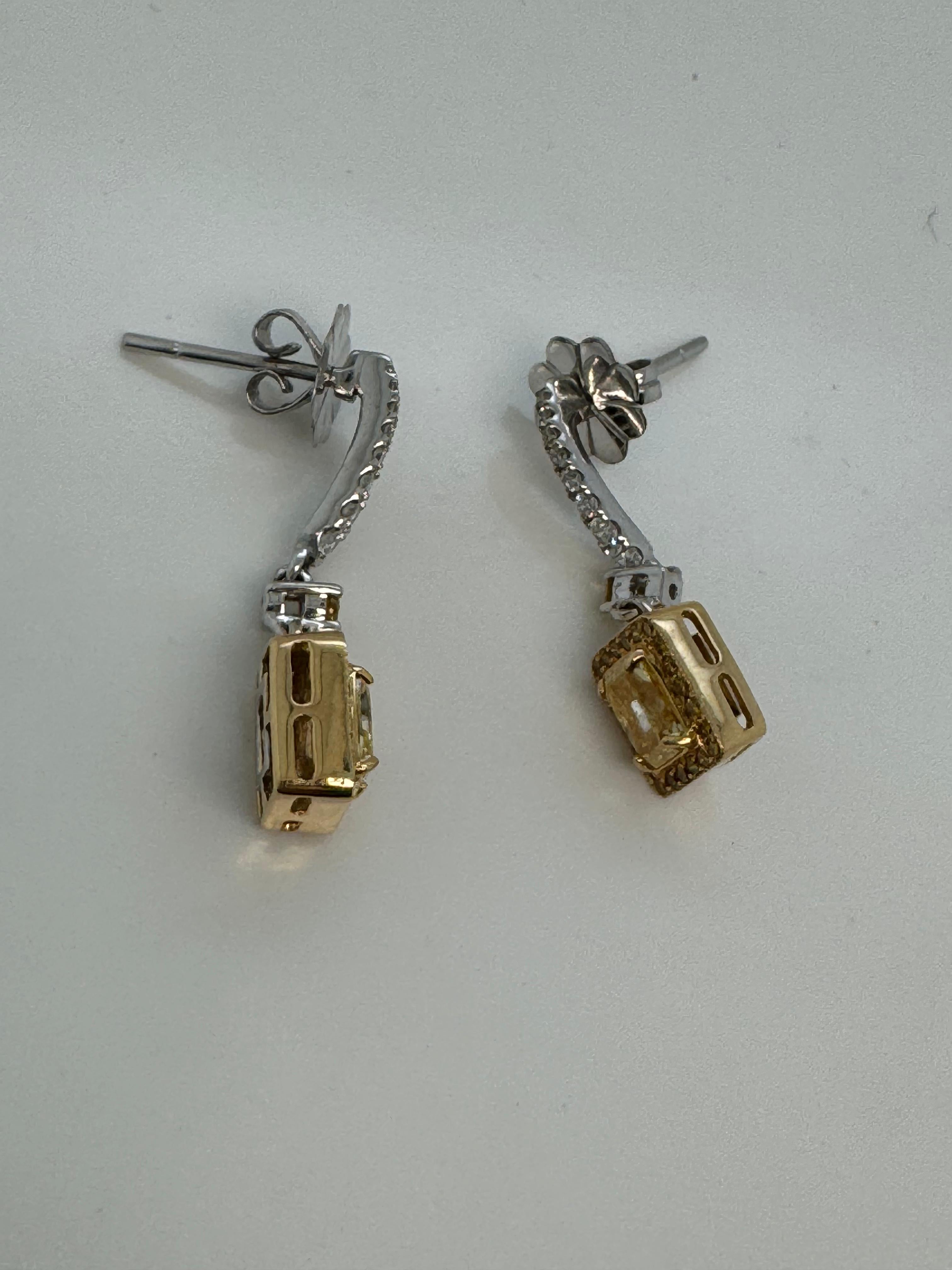 Introducing an elegant pair of earrings from Rewa Jewelry, combining refined sophistication with vibrant luxury.

Each earring features a GIA Certified Fancy Yellow diamond, weighing 0.66 carats (GIA-1226387526) and 0.63 carats (GIA-5222323623) with