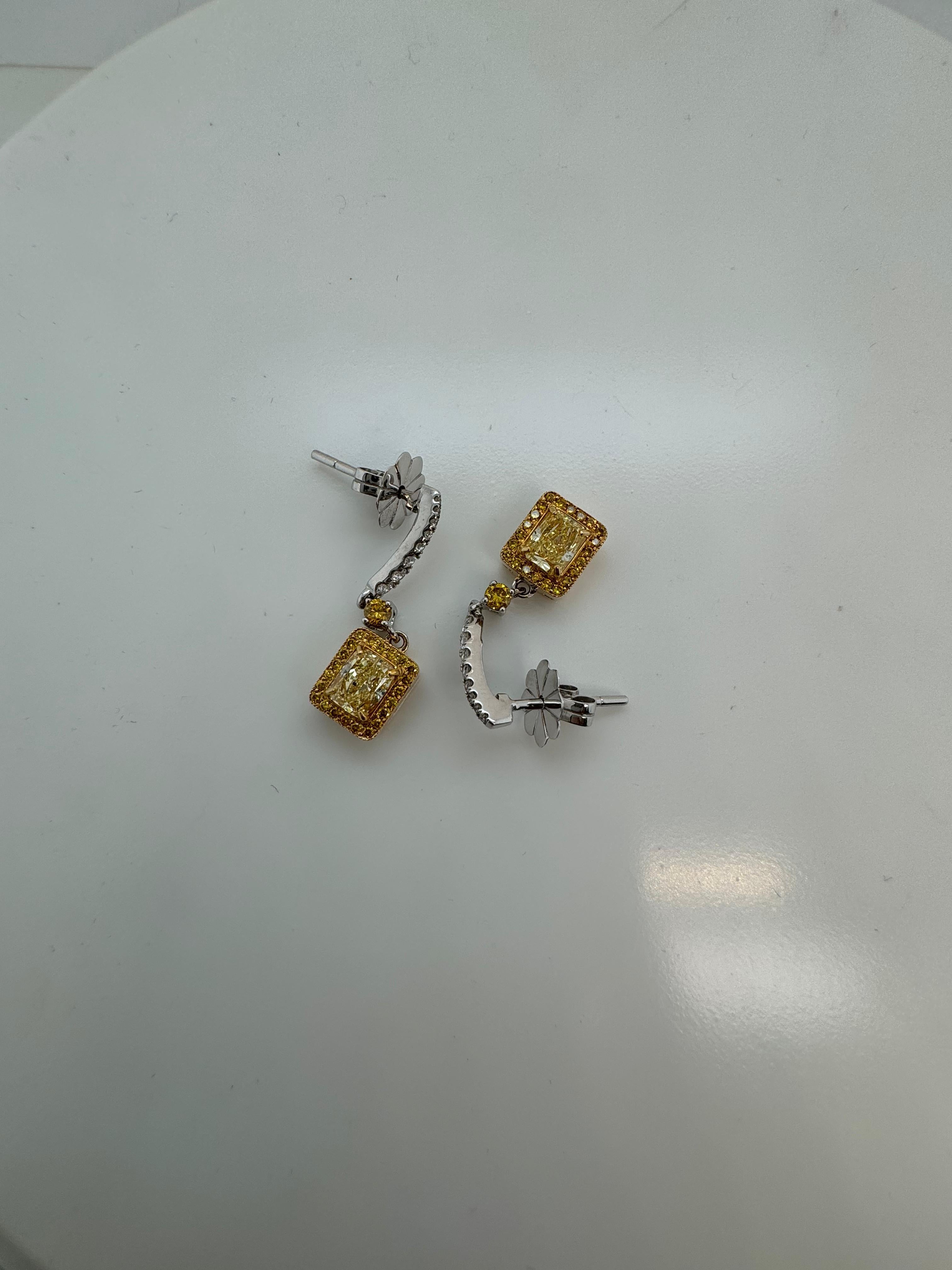 Cushion Cut GIA Certified 1.29 Carats Fancy Yellow Diamond Earrings in 18k White Gold For Sale