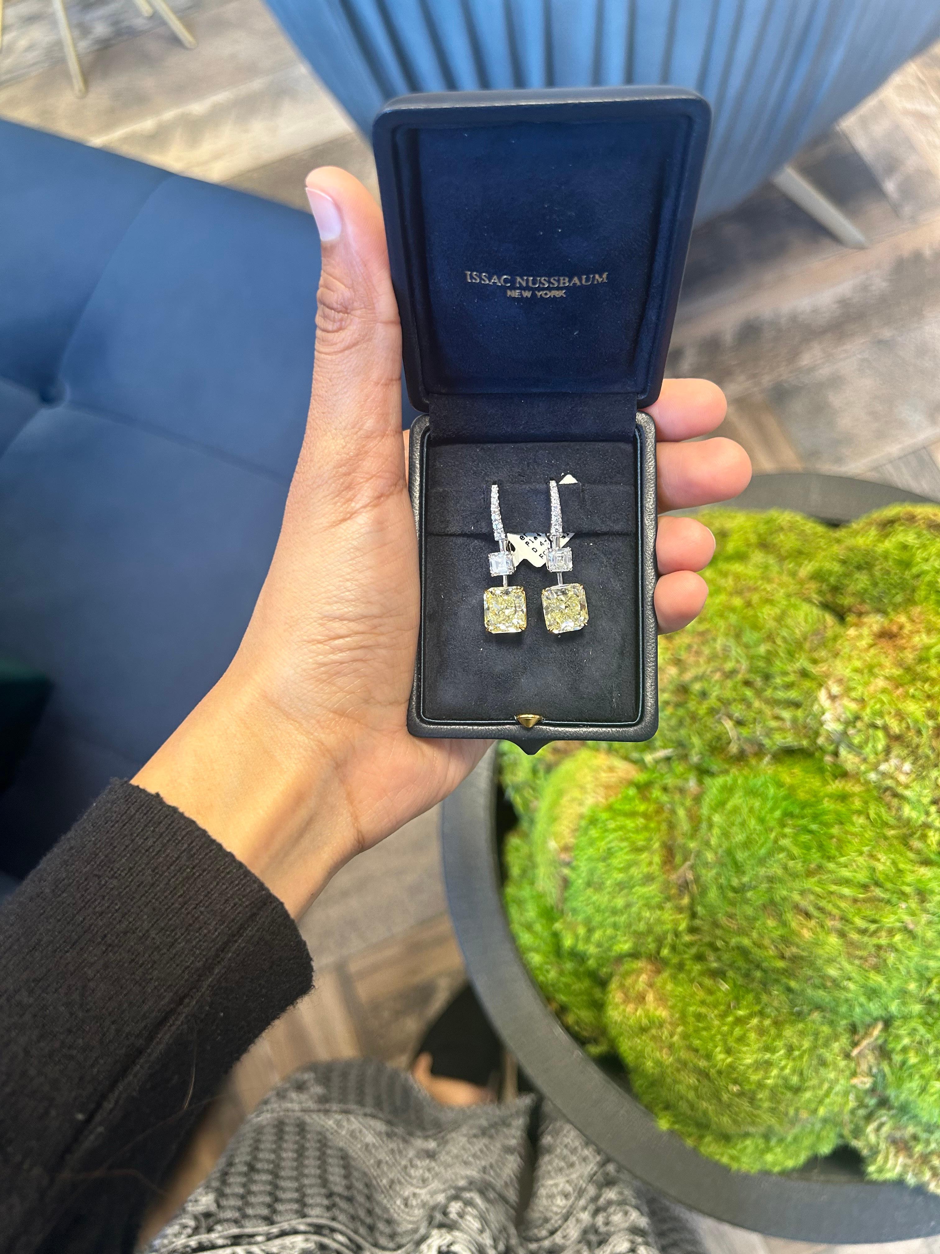 These earrings are not merely accessories—they are a statement of luxury and timeless beauty. GIA Certified 12.91 Carat 18K WG and YG Fancy Yellow dangle earrings with two colorless white (D-E) square emerald diamonds.

Crafted with meticulous