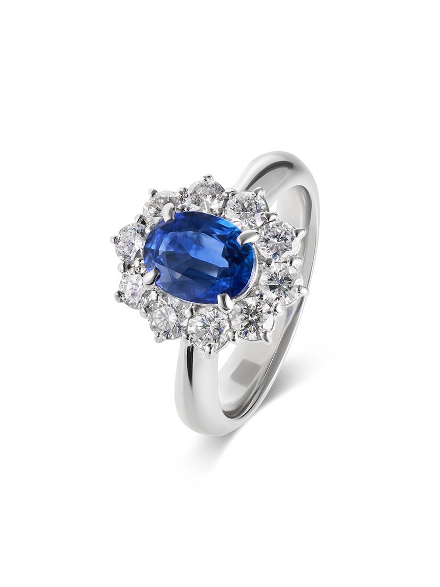 A stunning and sparkling, blue sapphire and diamond halo ring, set in a classic and timeless princess halo platinum setting. 

Specifications: 
Weight of Sapphire: 1.35 carats
Diamond Weights: 0.96 carats 
Certification: GIA 
Metal Type: Platinum
