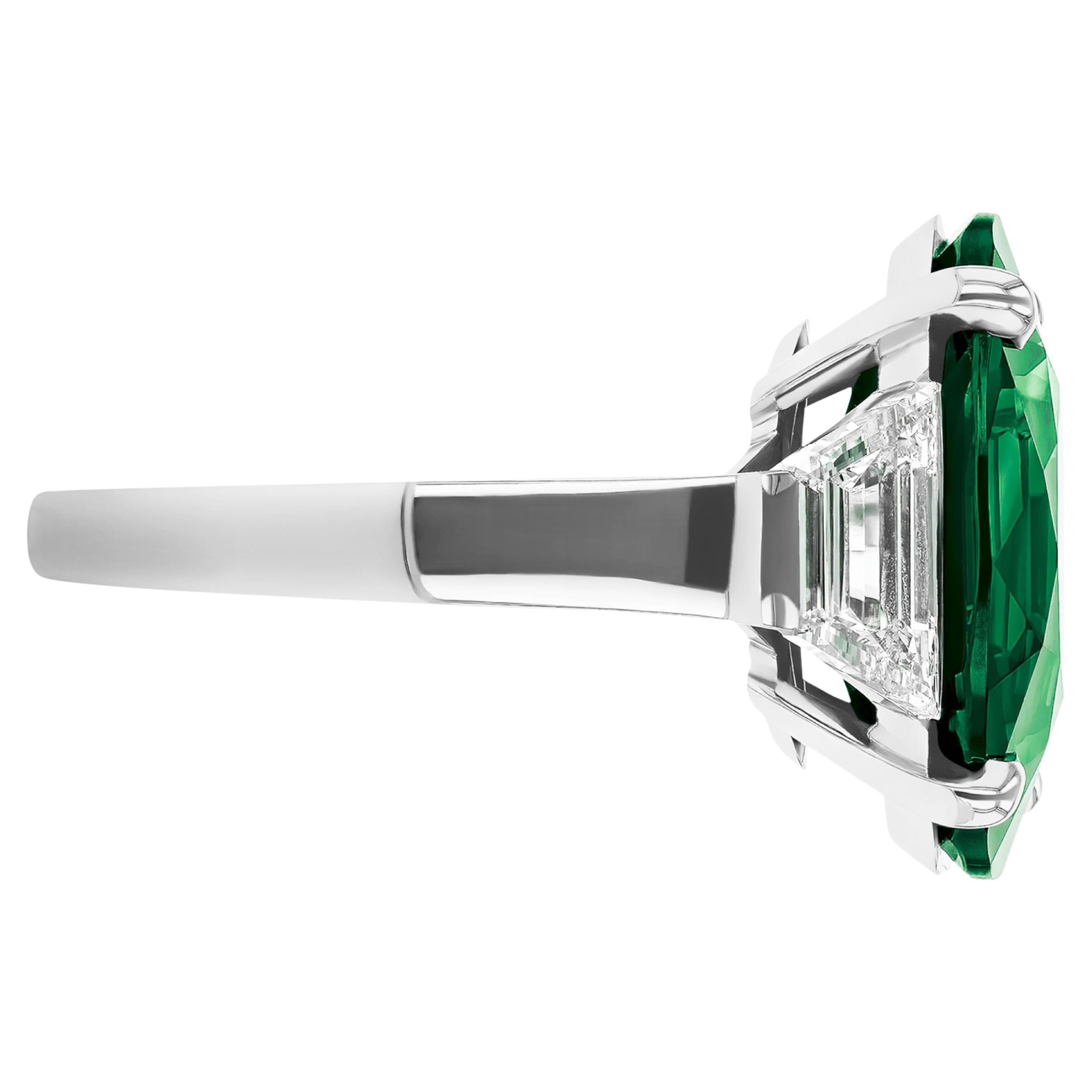Indulge in timeless elegance with this breathtaking ring, featuring a substantial 13-carat oval sgape emerald , certified by GIA. —this gem boasts a gorgeous intense green hue with remarkable brilliance.


