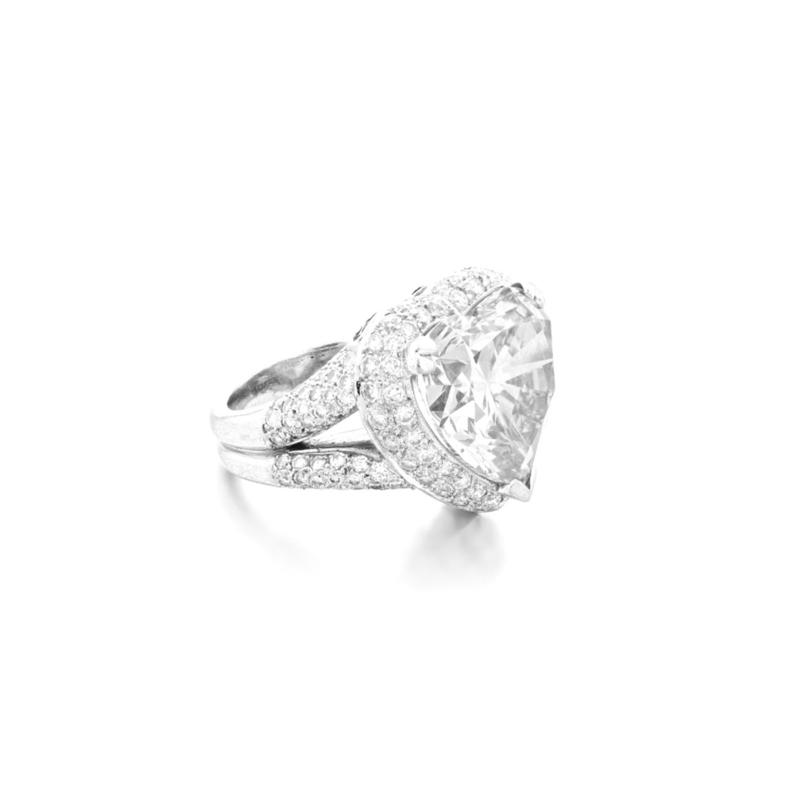 Adorned with a type 2A Golconda type heart-cut diamond weighing 13 carats, the setting partially paved with brilliant-cut diamonds, finger size 6

Accompanied by two GIA certificates also the type IIA

the mounting is  partially paved-set with
