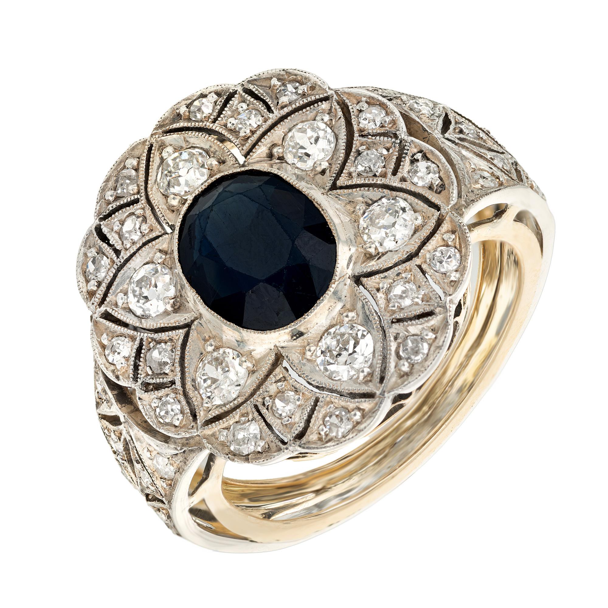 Natural 1.30 carat oval cut dark blue sapphire and diamond cocktail ring. This beautiful Victorian ring begins with an oval center sapphire that is GIA certified as natural with no treatments of any kind, no indications of heating. 23 round diamonds